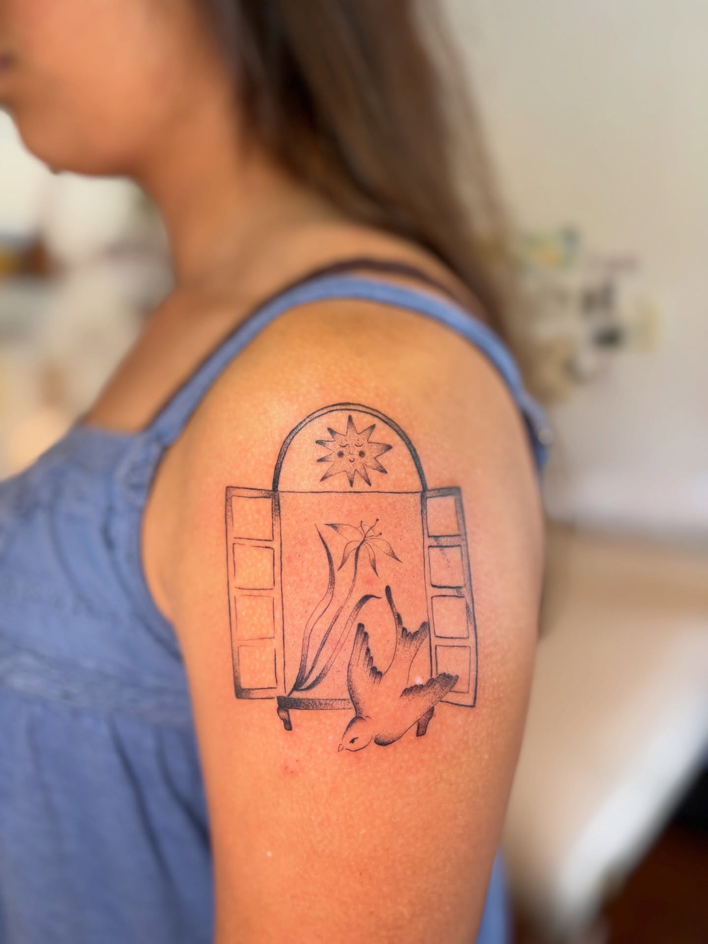 Open window with birds black and grey tattoo on the shoulder by carla sofia