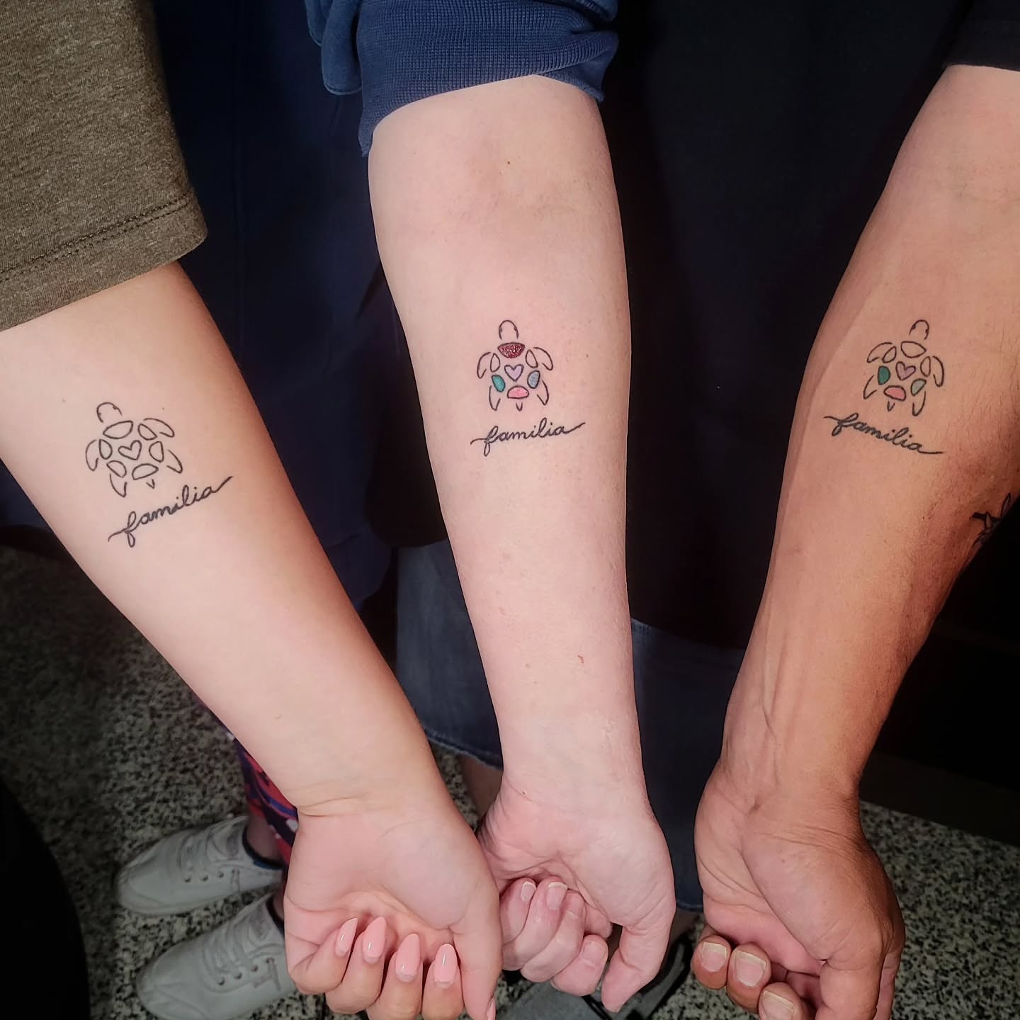 Family fine line tattoo on the forearm by Sarah Alba
