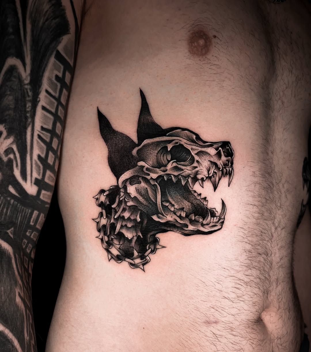 Dog skull with chain realism tattoo on the ribs by ✿ Desiree Gawle ✿