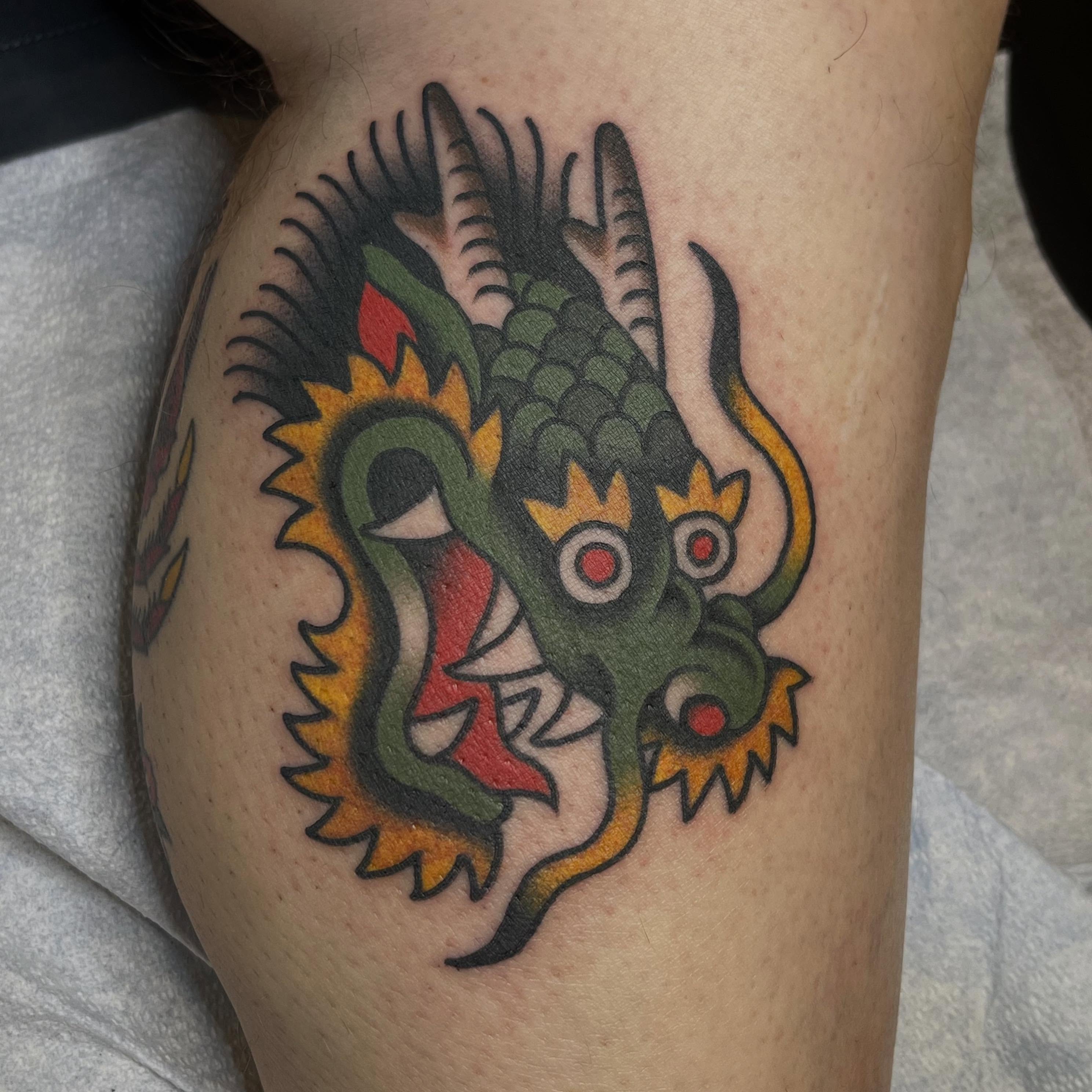 Dragon American traditional tattoo on the thigh by Kayla Gibson, Portland, Oregon