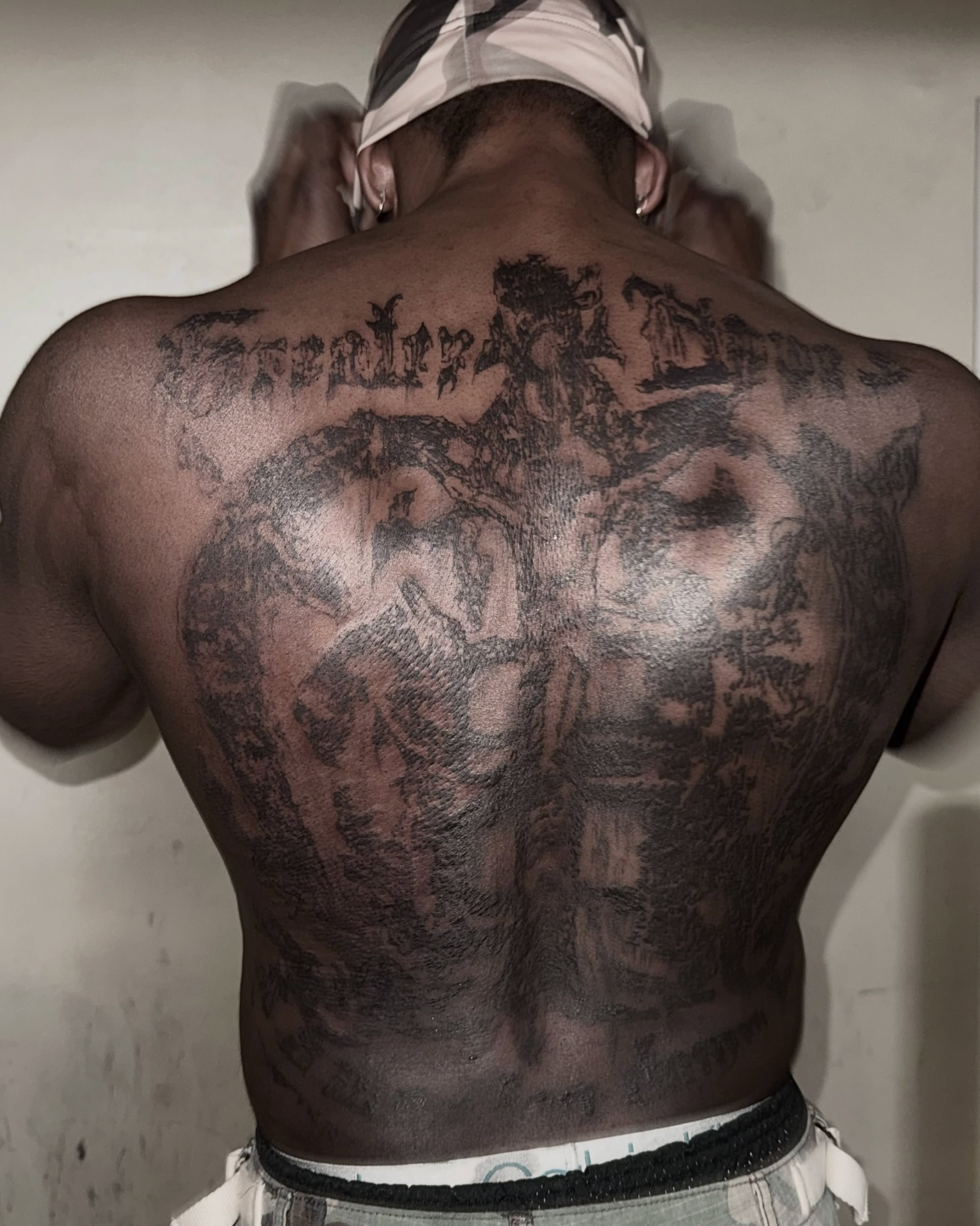 Man with back tattoo black and grey tattoo on the back by @douohv
