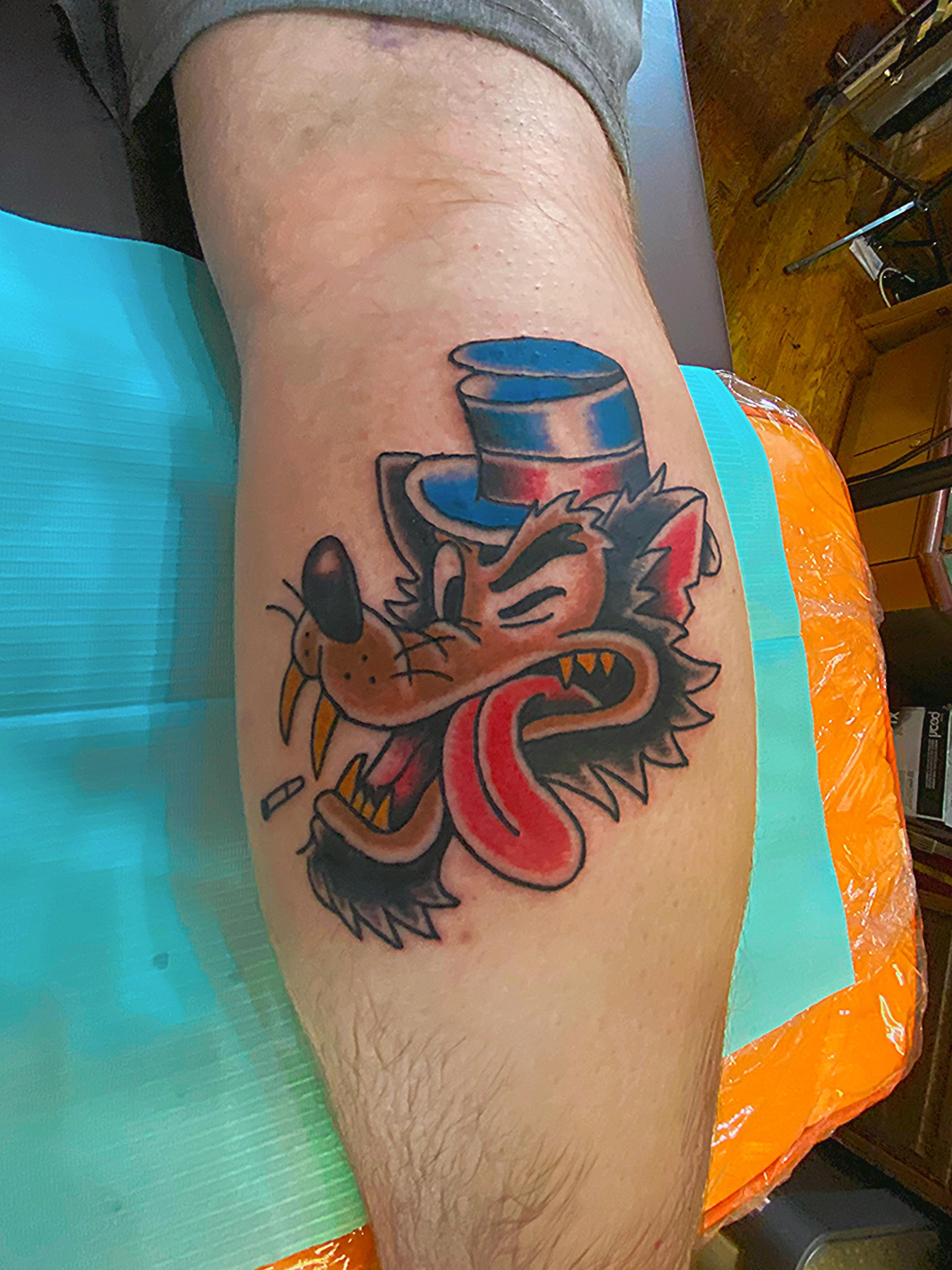 Mad hatter American traditional tattoo on the thigh by Tommy O'Connell