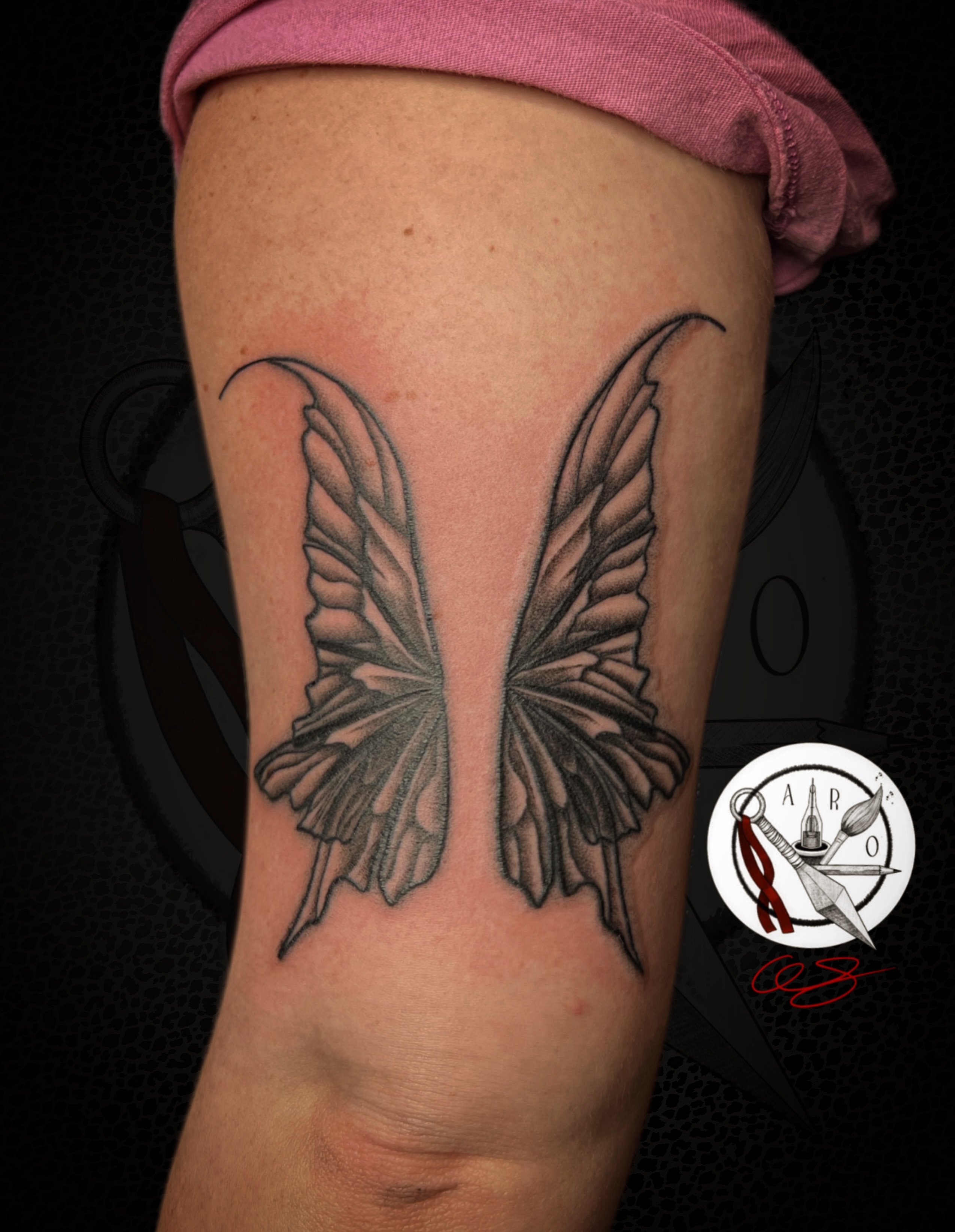 Butterfly wings black and grey tattoo on the forearm by Aaron Strobehn