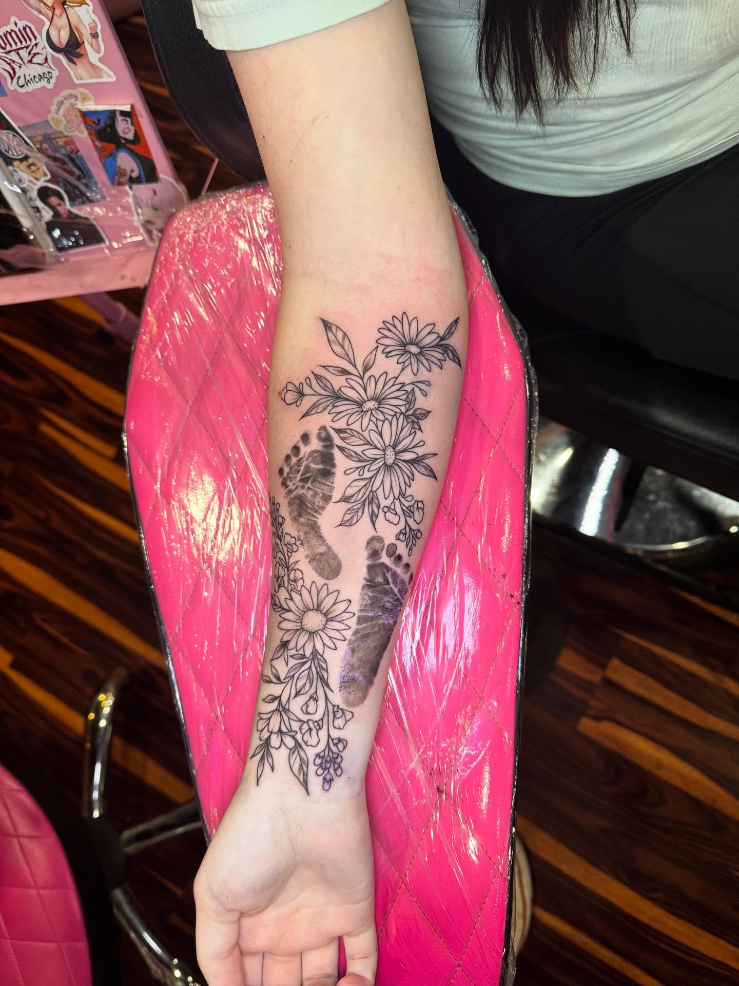 Footprint with floral design black and grey tattoo on the forearm by Bekahboogah