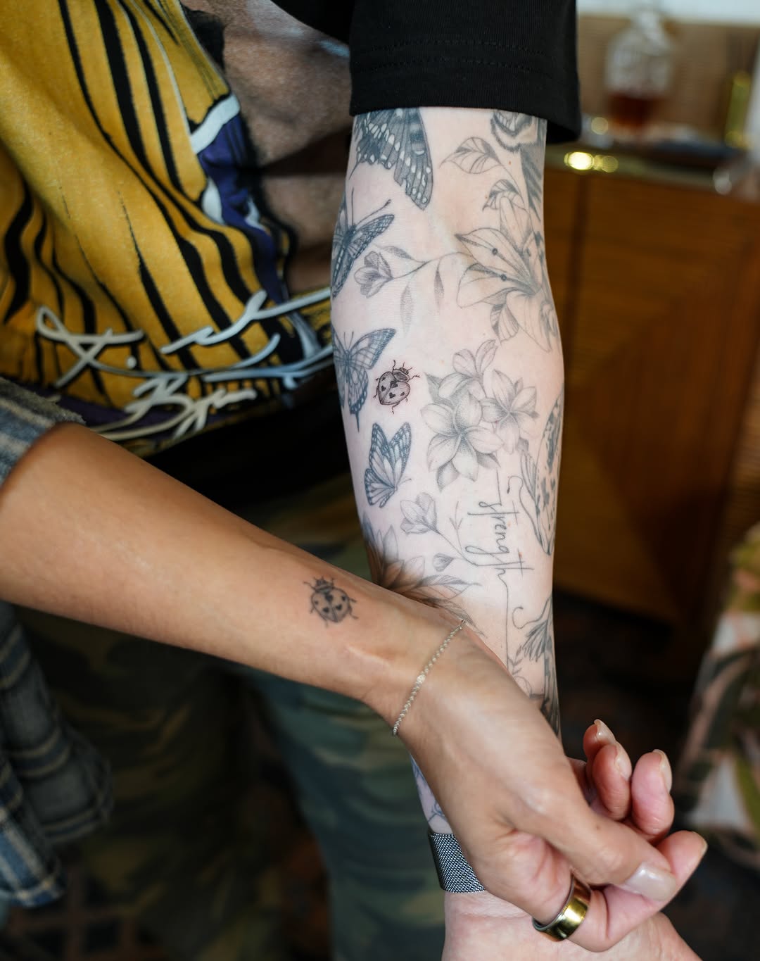Butterflies and flowers minimalist tattoo on the forearm by 🤍 Sarah 🖤