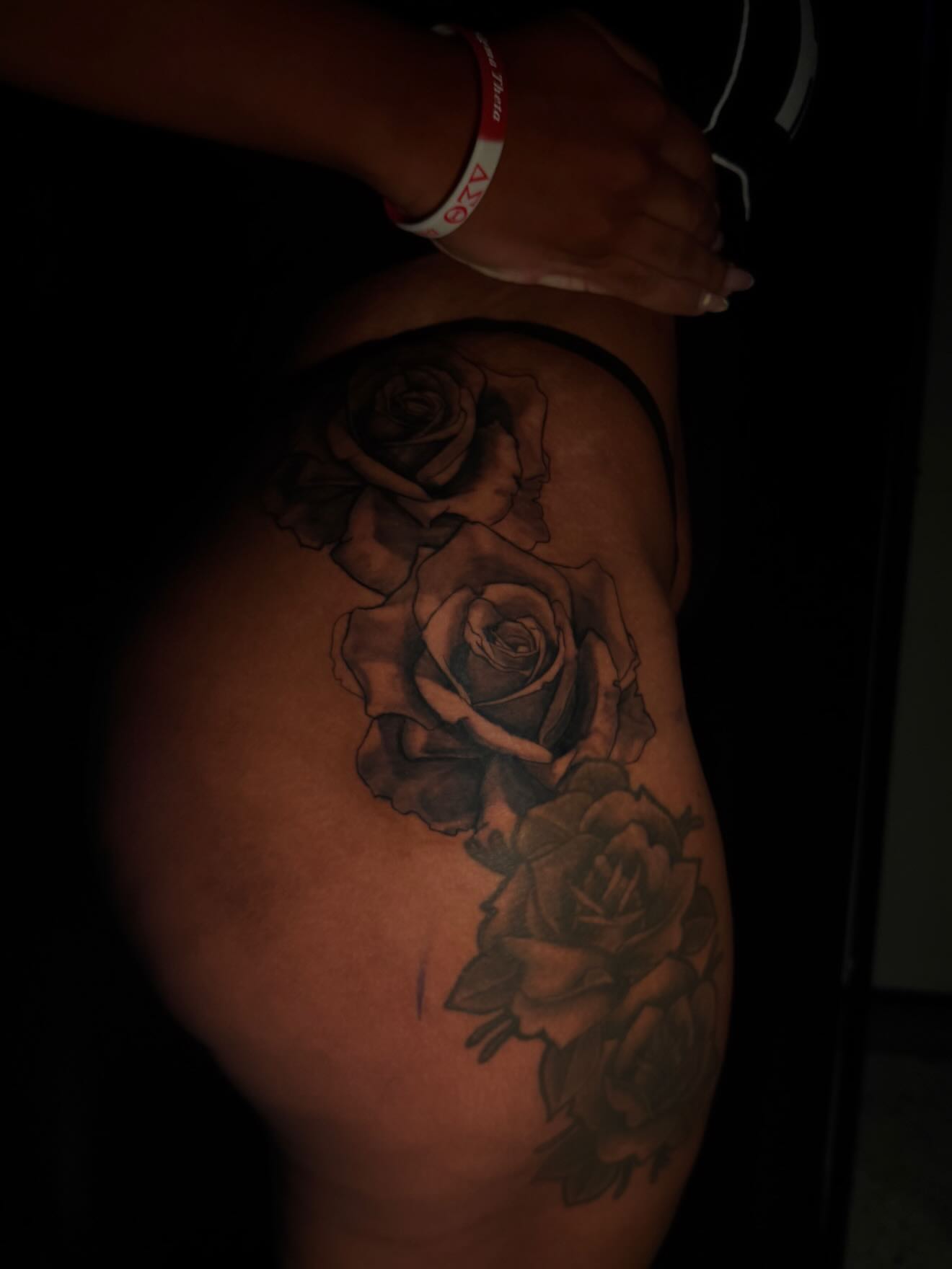 Roses black and grey tattoo on the thigh by Anthony Washington, Atlanta, Georgia