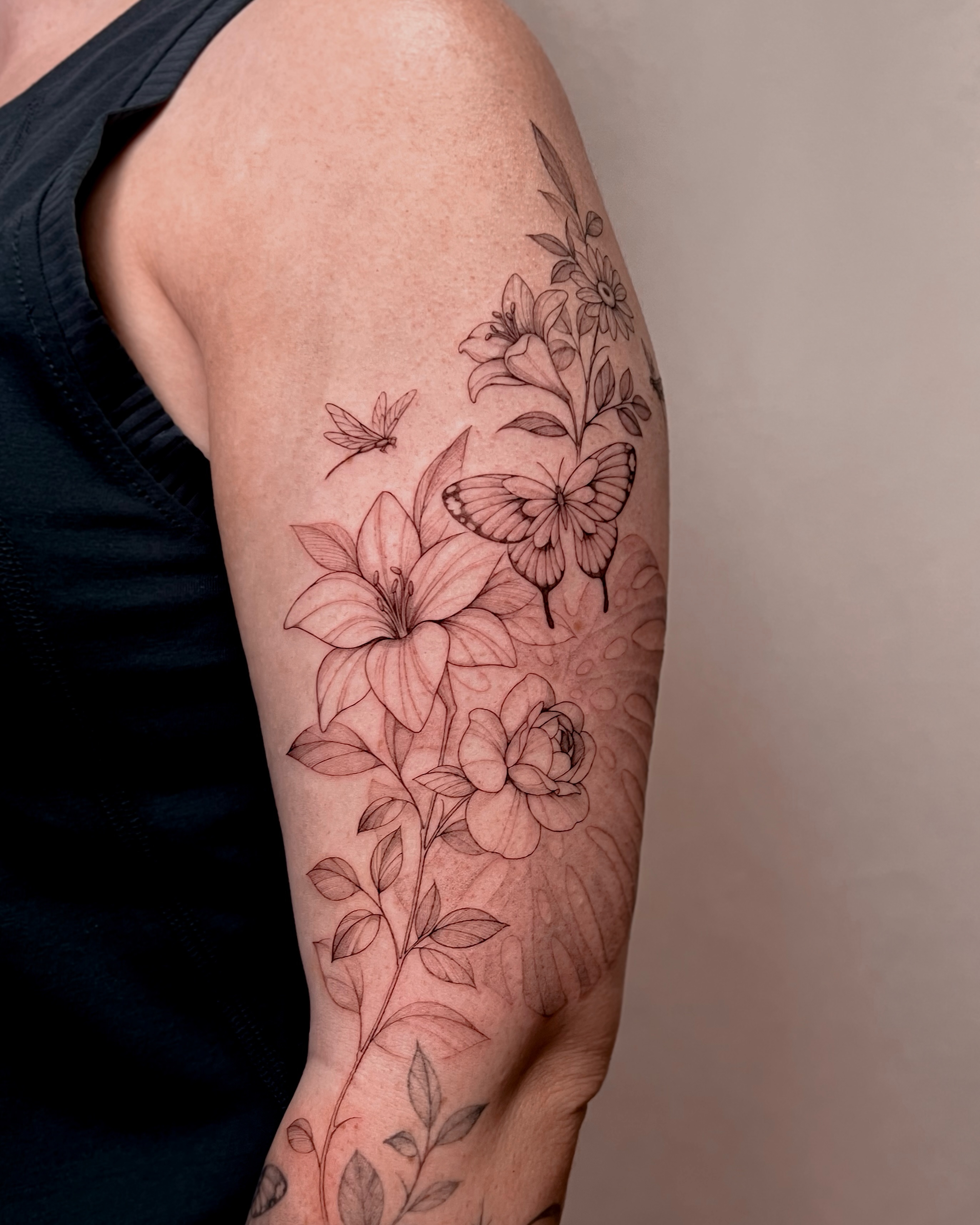 Flowers and butterflies black and grey tattoo on the forearm by Hyn[hin]