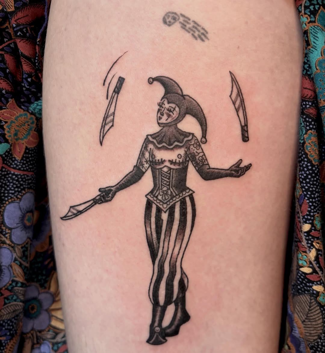 Juggling jester with knives sketch tattoo on the forearm by Fin :