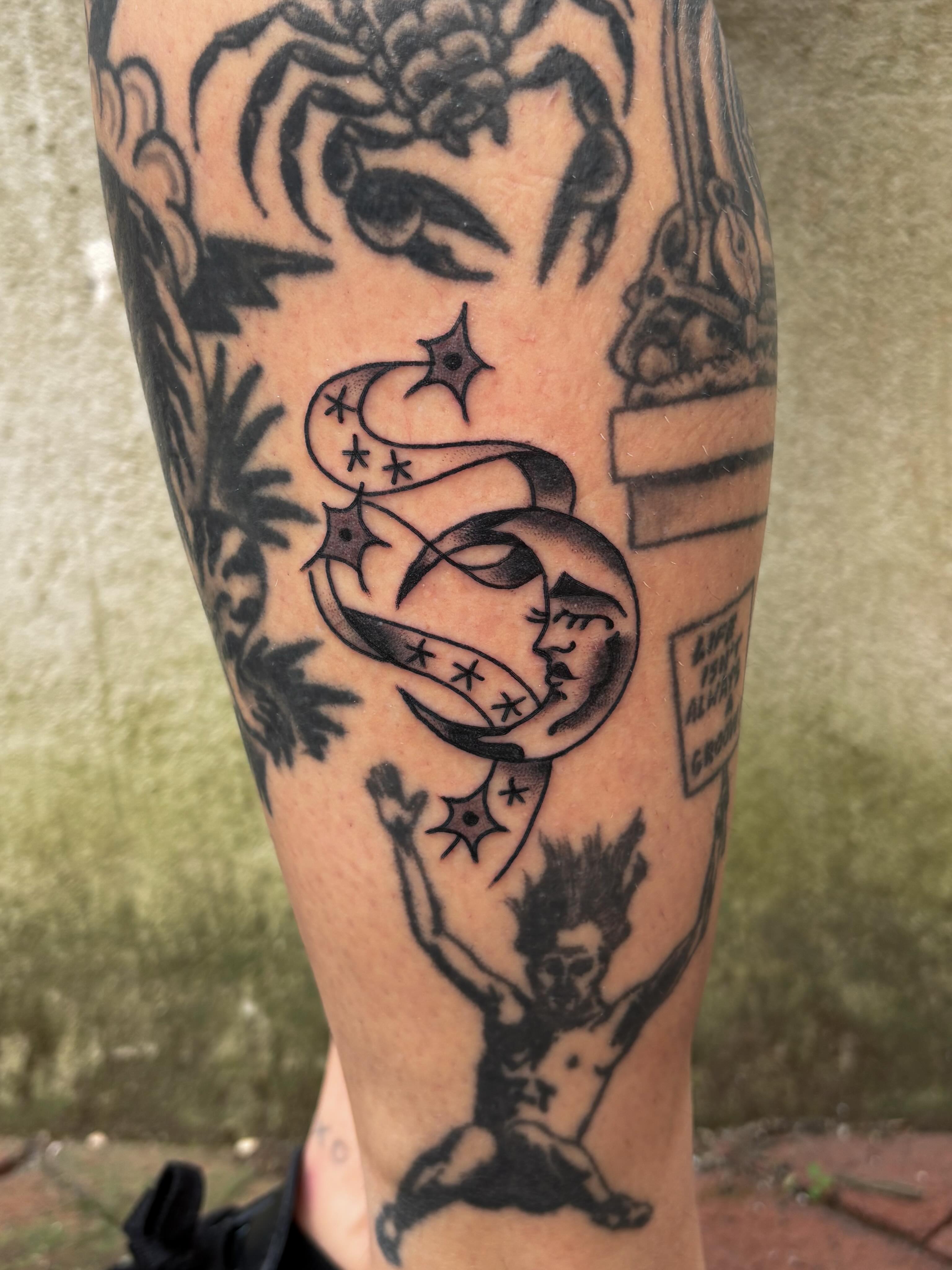 Moon and stars black and grey tattoo on the forearm by Evan Bisso, Philadelphia, Pennsylvania