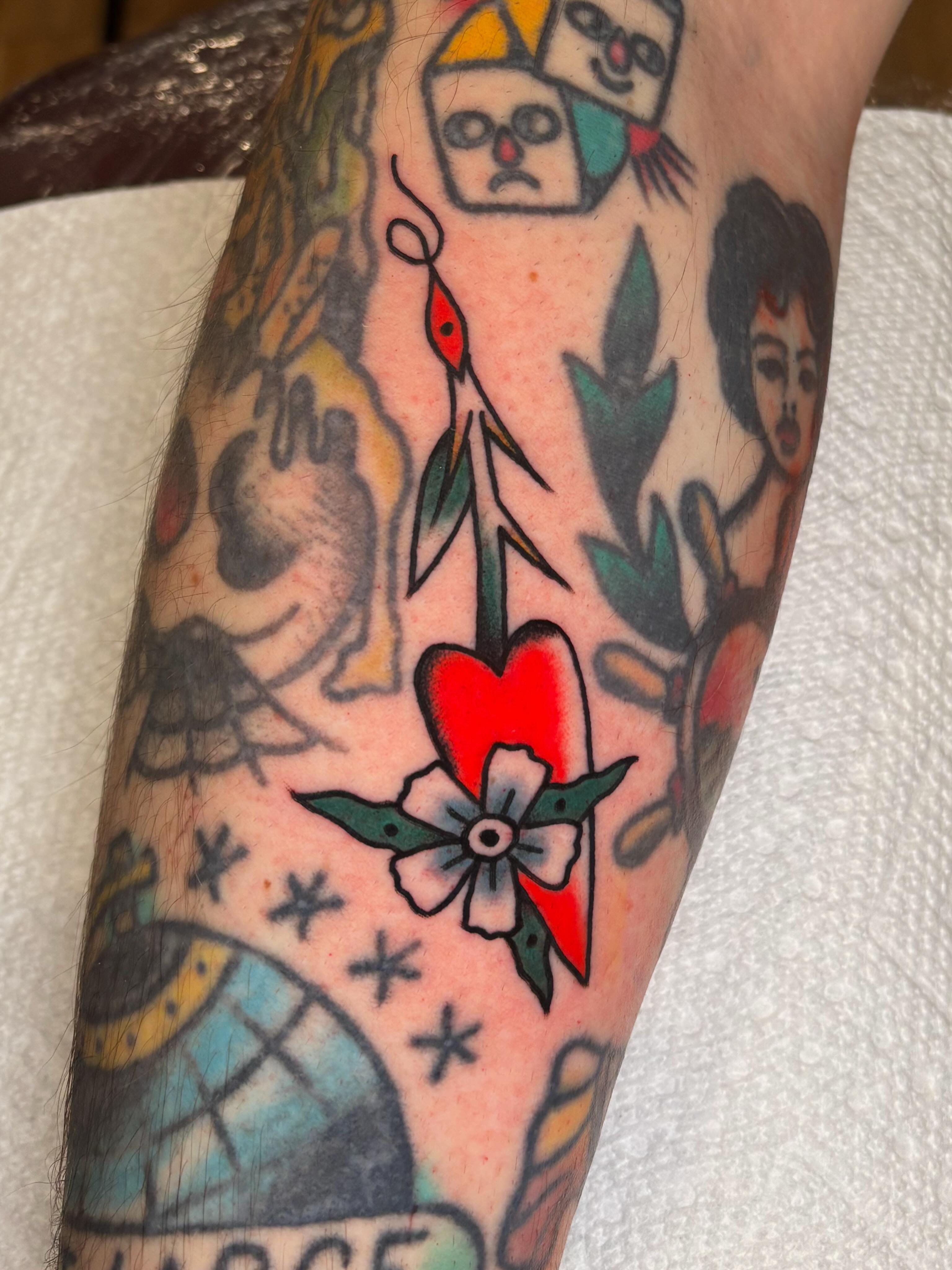 Heart with flower American traditional tattoo on the forearm by Evan Bisso, Philadelphia, Pennsylvania
