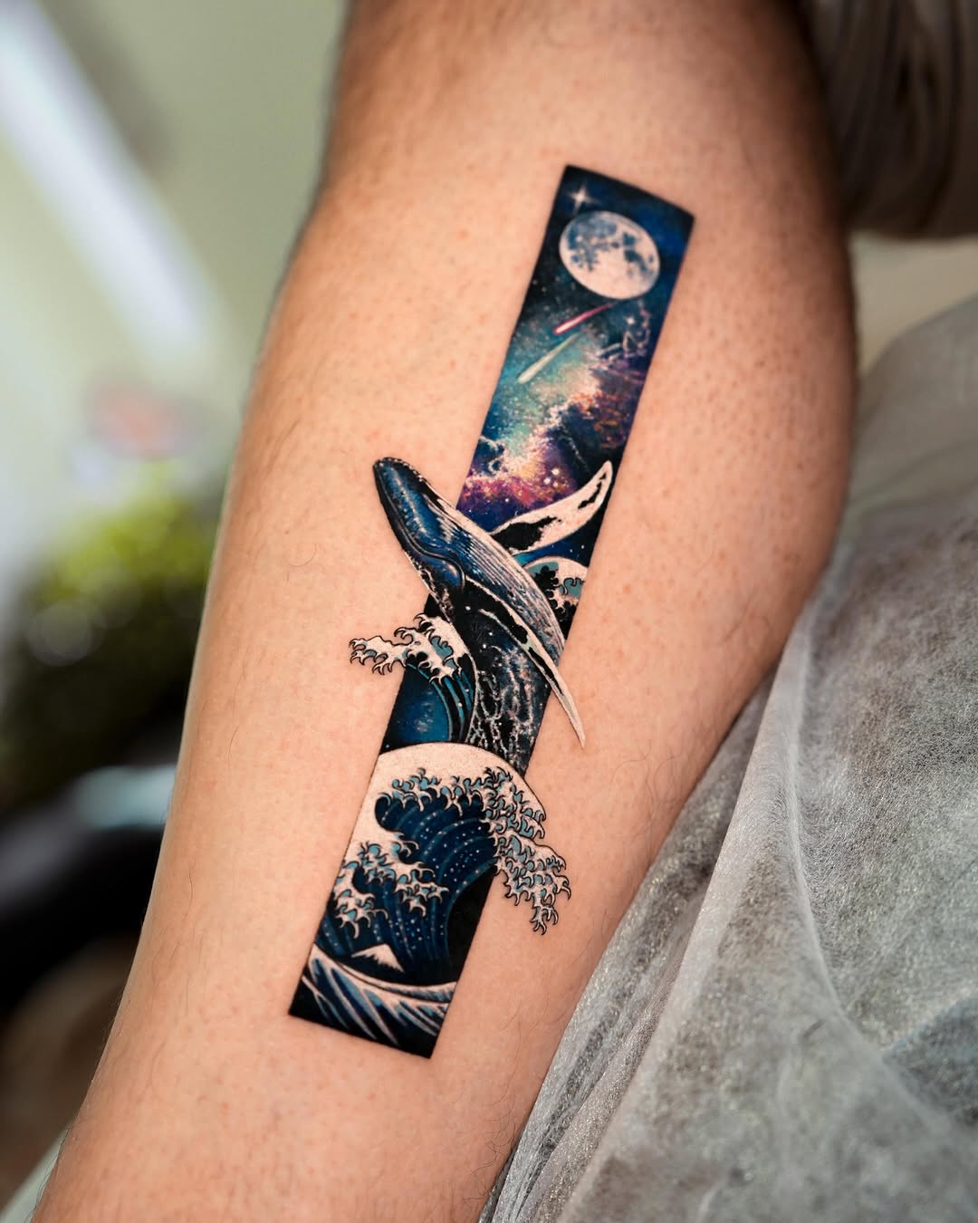 Whale and galaxy watercolor tattoo on the forearm by EQ