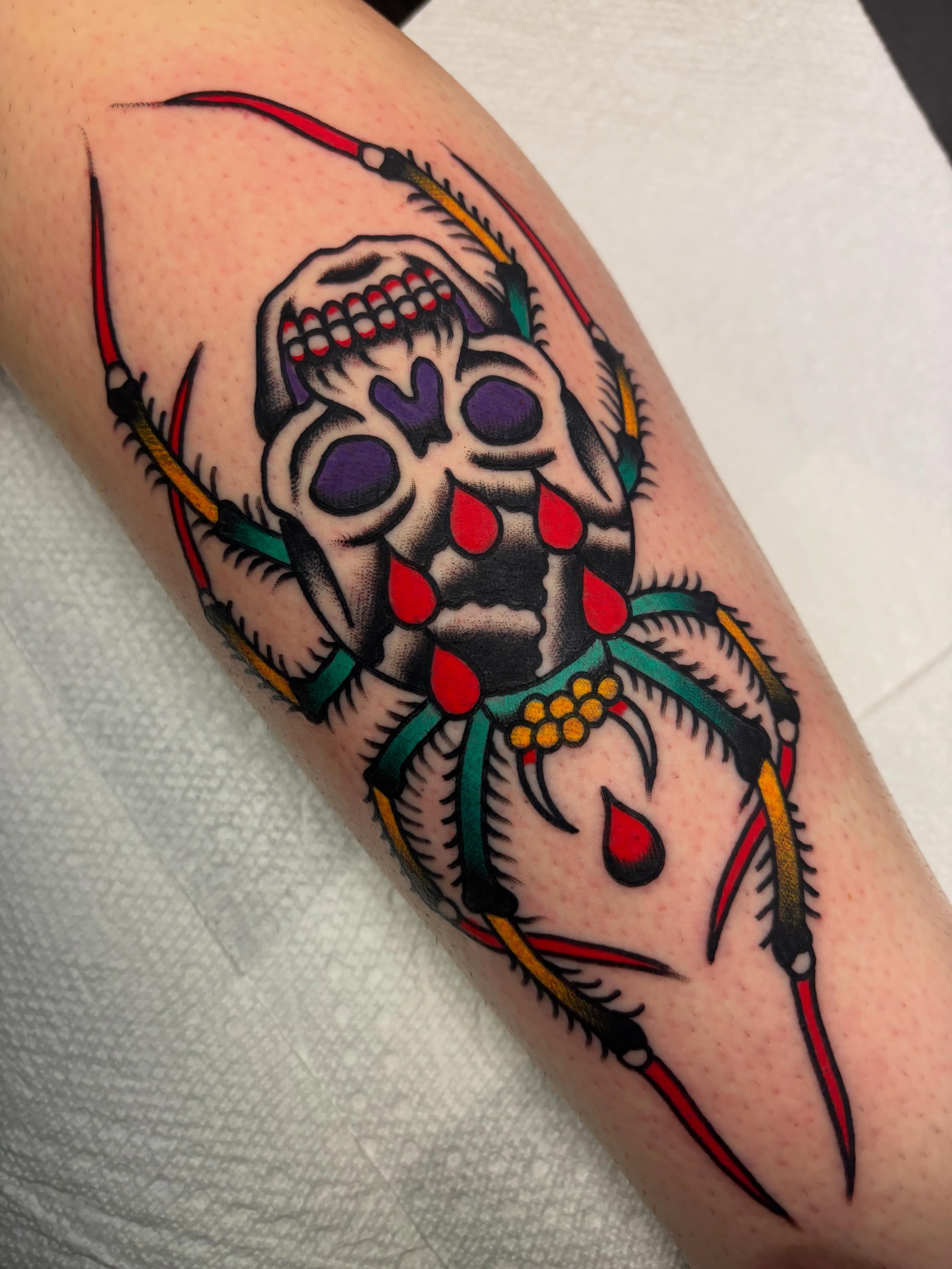 Skull with arrows American traditional tattoo on the forearm by Chris Dufresne