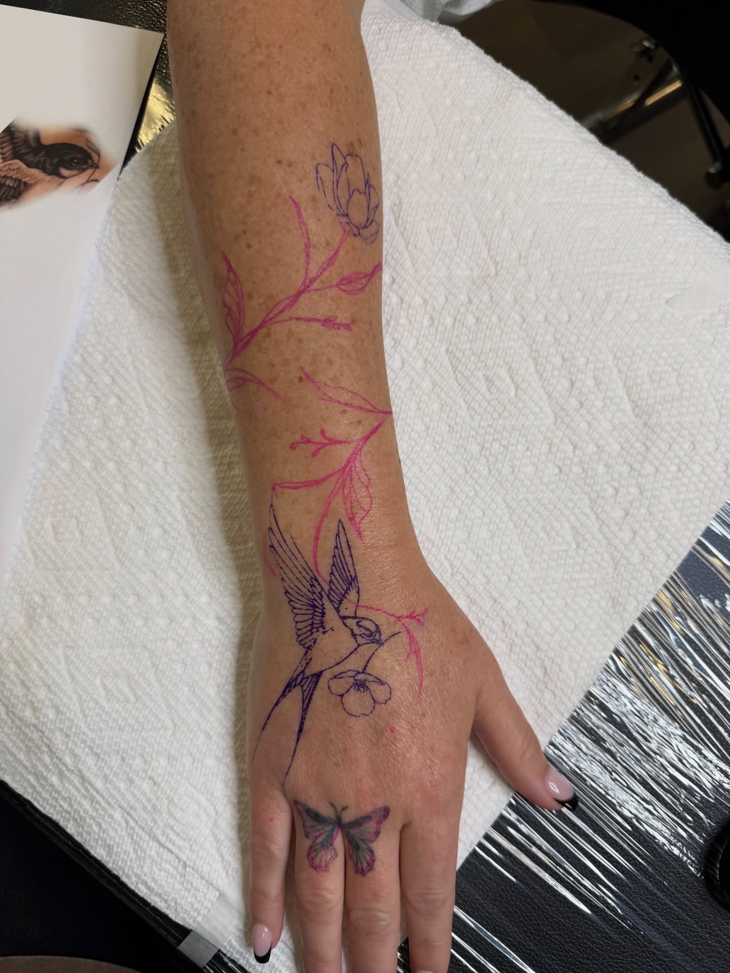 Bird and flowers new school tattoo on the hand by WhoisLaineyTattoos