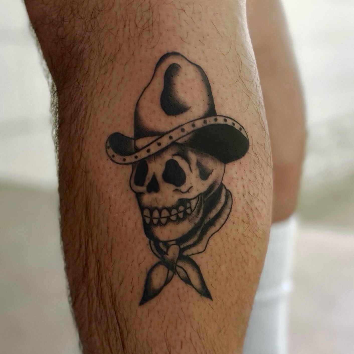 Cowboy skull black and grey tattoo on the forearm by Béle Benard