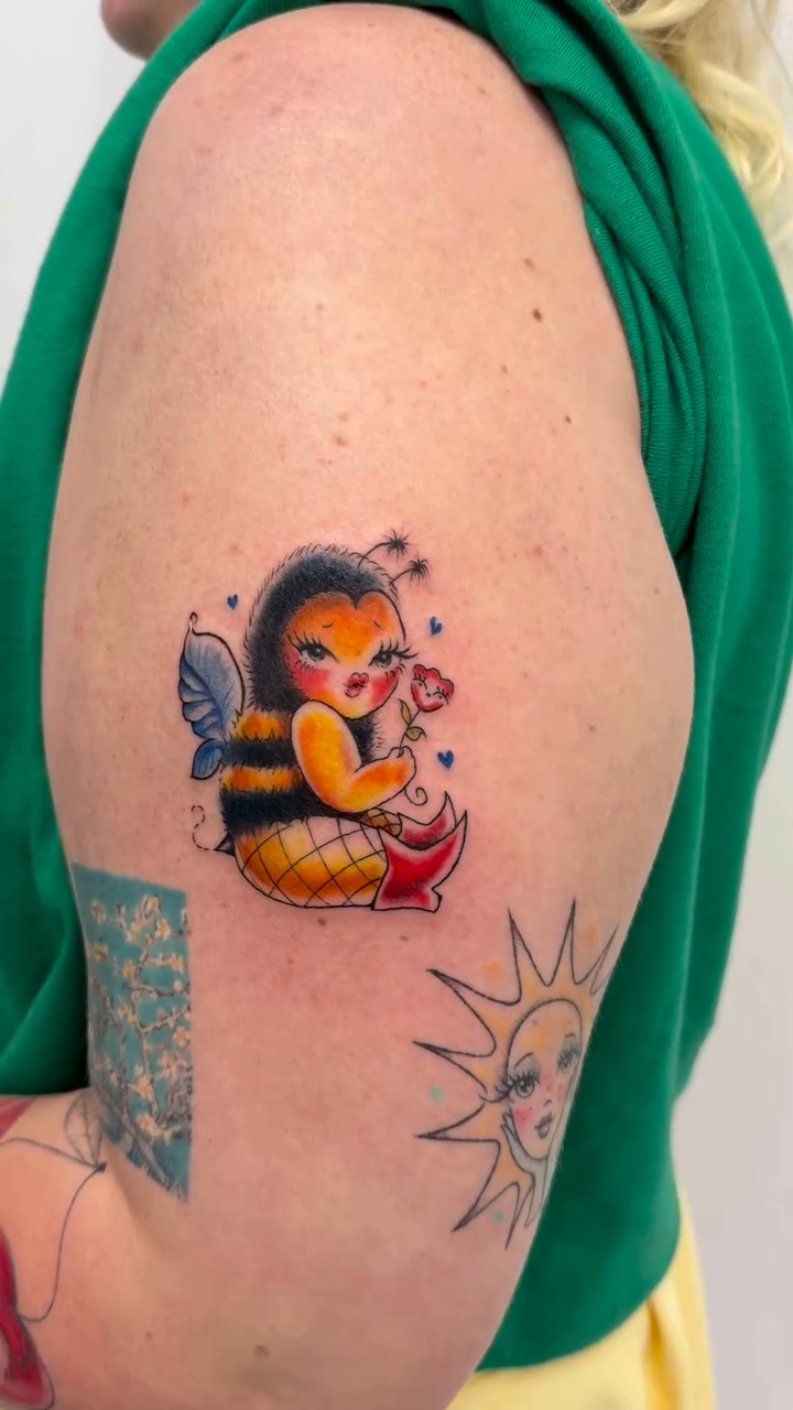 Neo-traditional tattoo on the upper arm by tattooz by megz