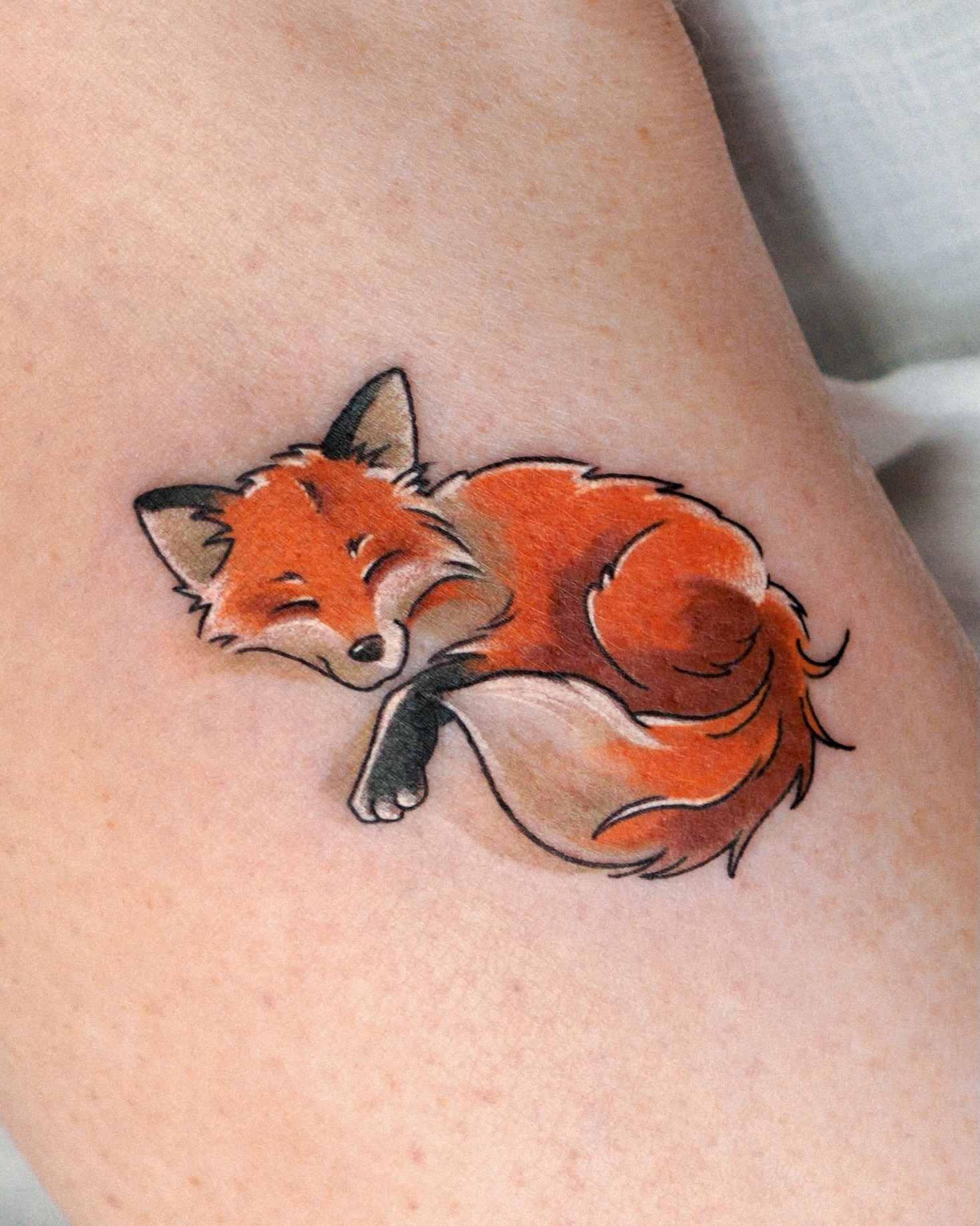 Sleeping fox realism tattoo on the thigh by Eden