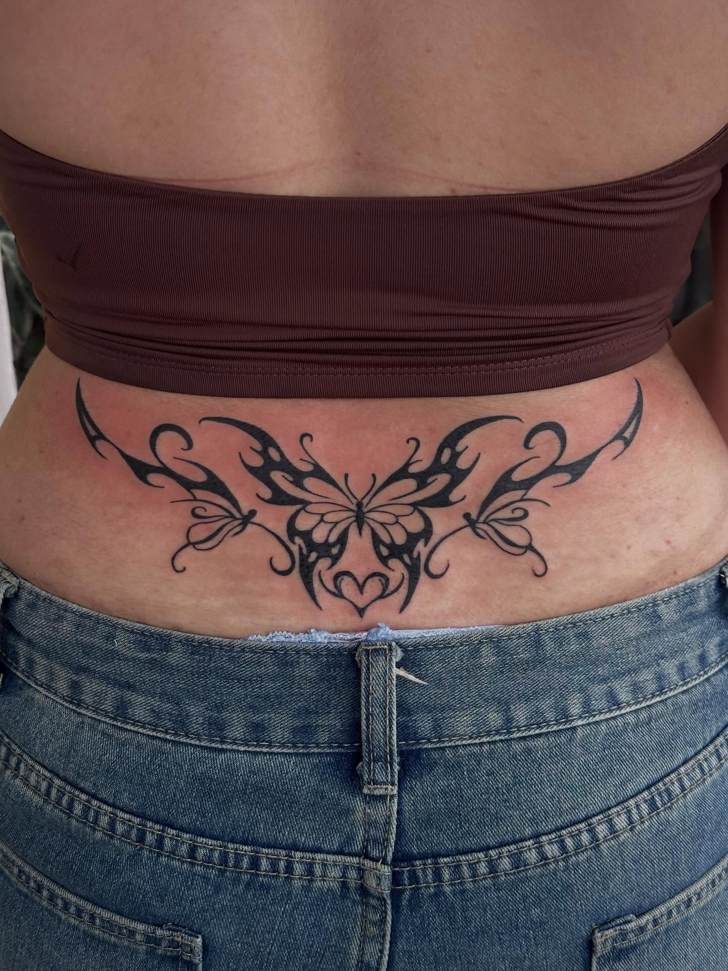 Butterfly tribal tattoo on the torso by Jared Allen, Saint Petersburg, Florida