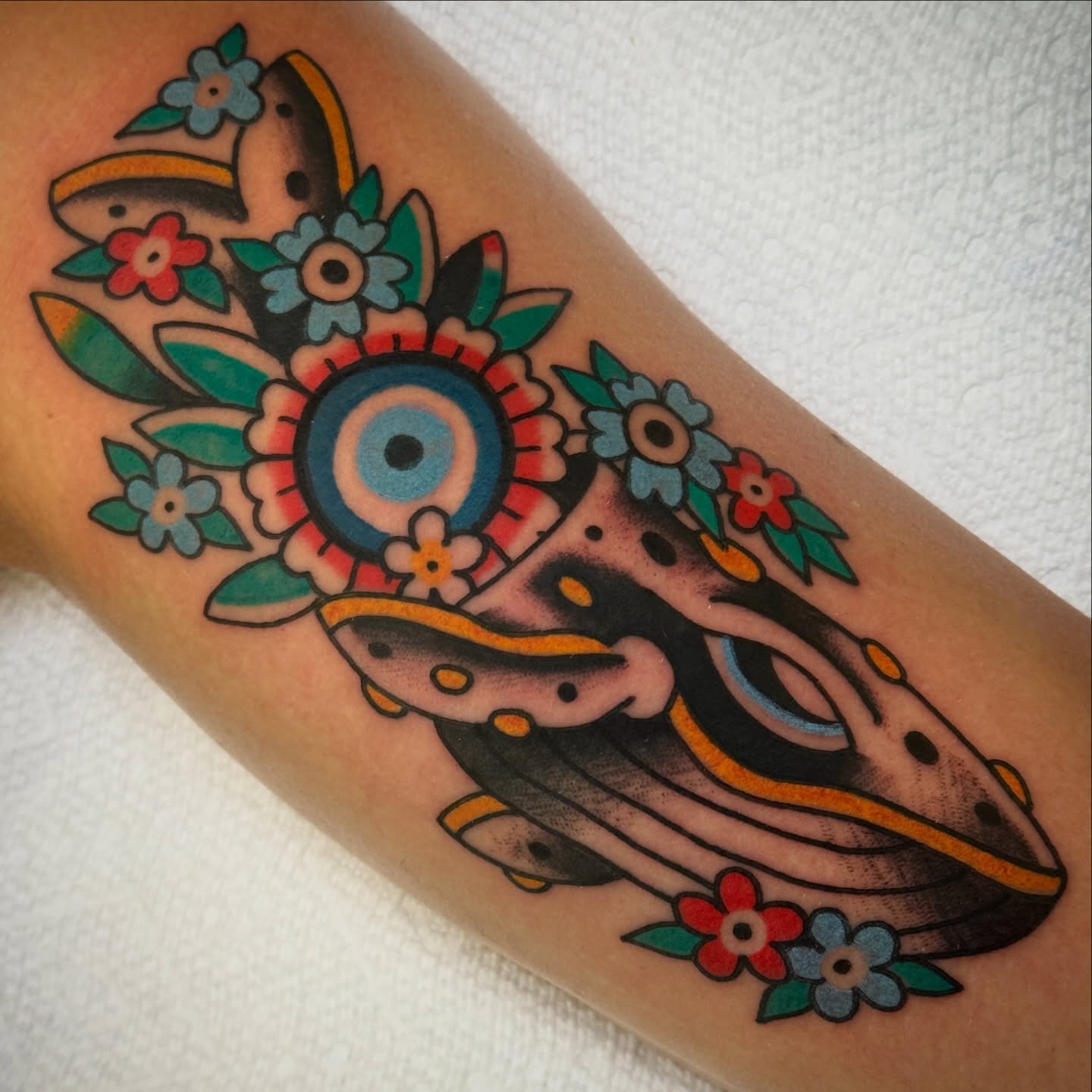 Whale and floral American traditional tattoo on the forearm by Rafael Torres, San Francisco, California