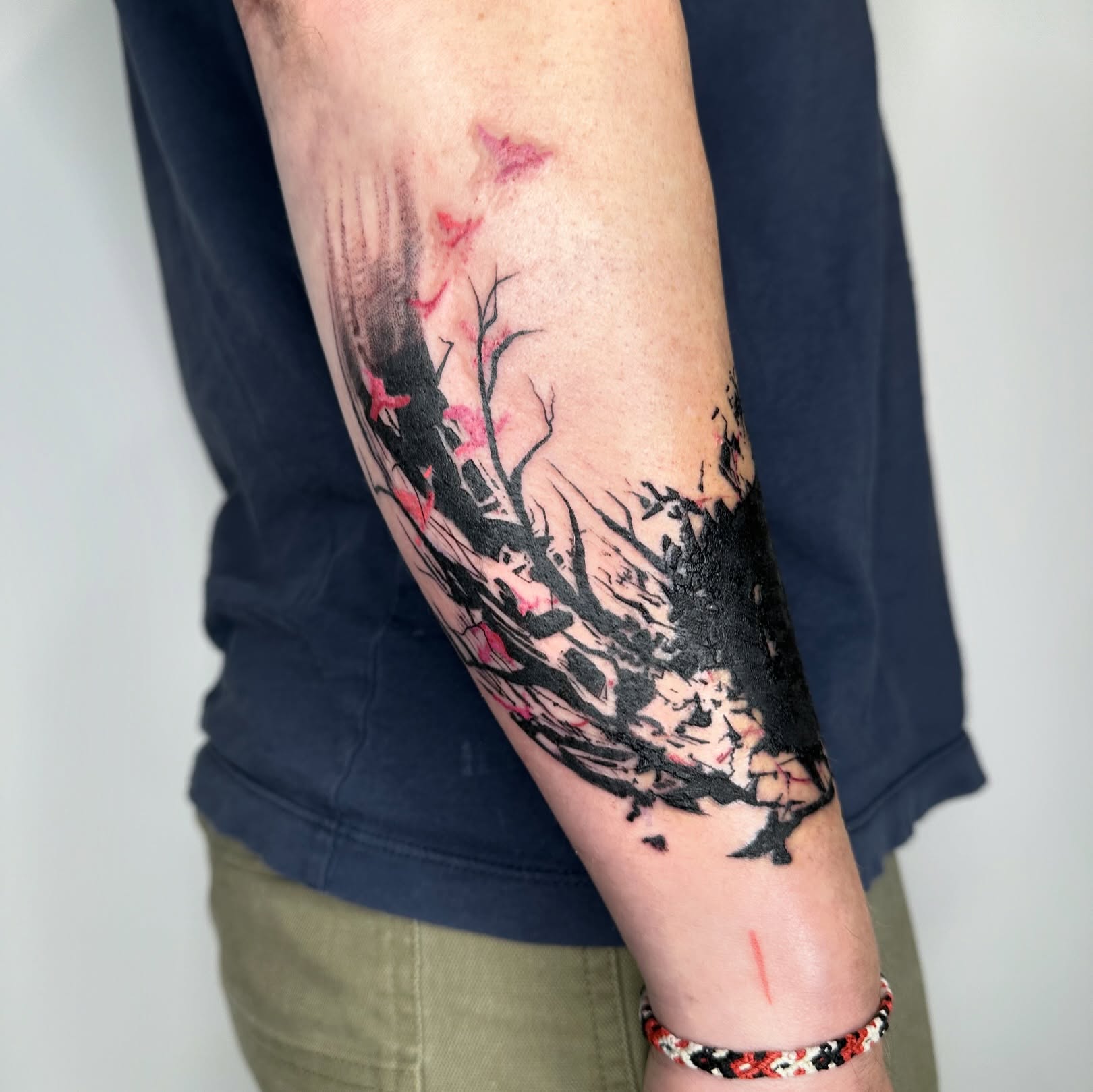Cherry blossom tree watercolor tattoo on the forearm by reid - tattoo artist