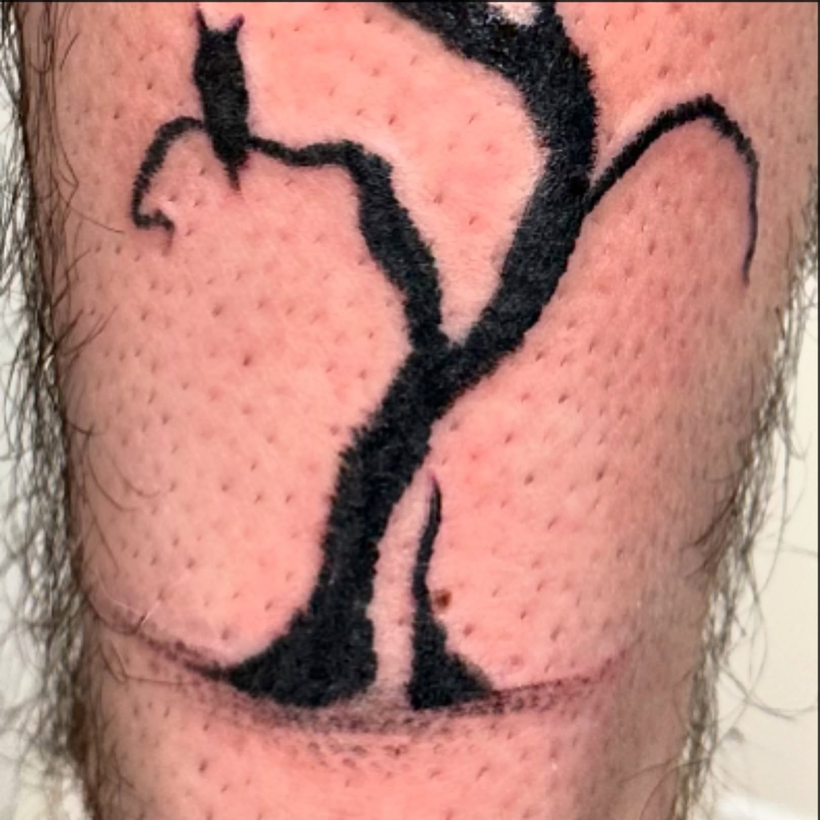 Abstract shape black and grey tattoo on the forearm by reid - tattoo artist