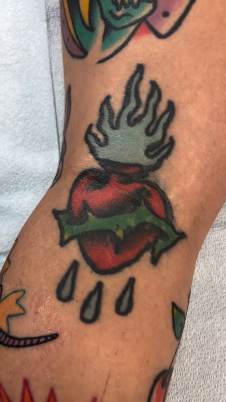 Sacred heart with flames and tears American traditional tattoo by Waylon
