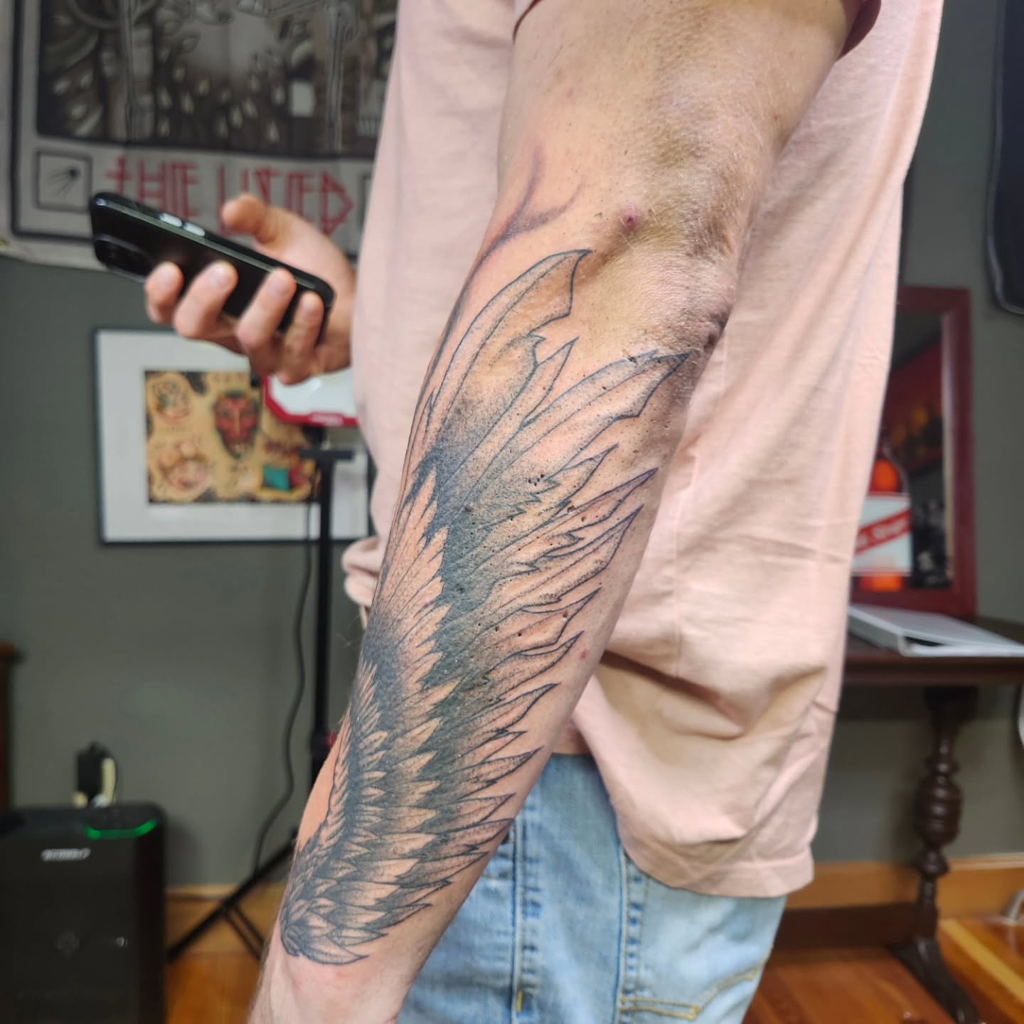 Wing black and grey tattoo on the forearm by @rockinr33d.tattoos