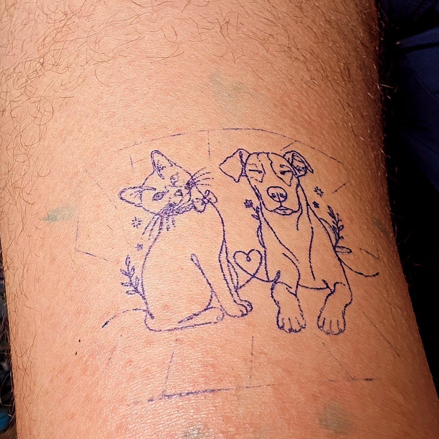 Cat and dog fine line tattoo on the thigh by Tony