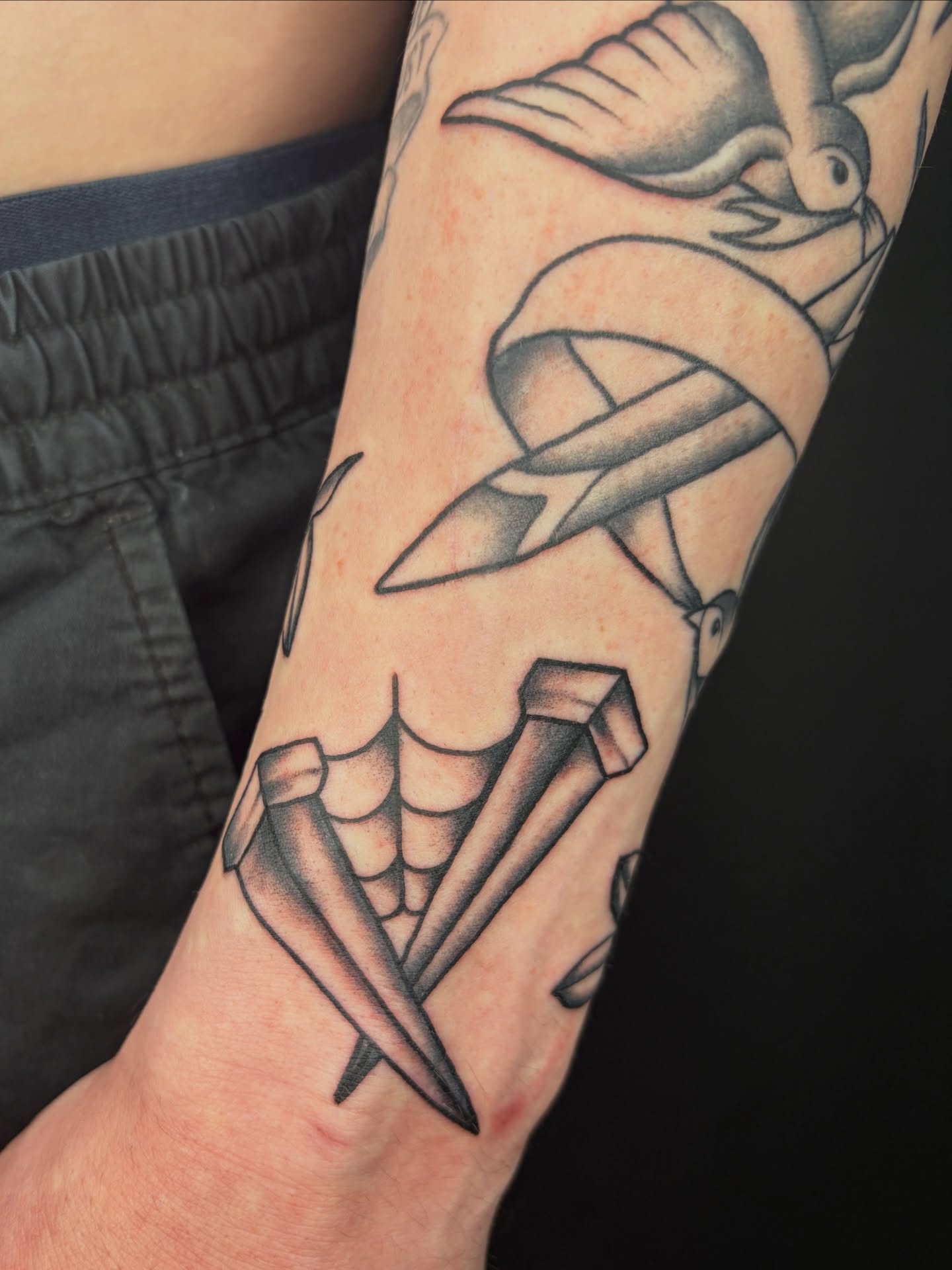 Clawed hand American traditional tattoo on the forearm by Poppy Olivia Deards
