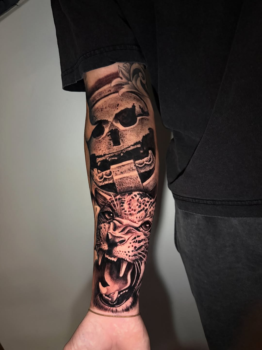 Skull and jaguar realism tattoo on the forearm by inkzombi