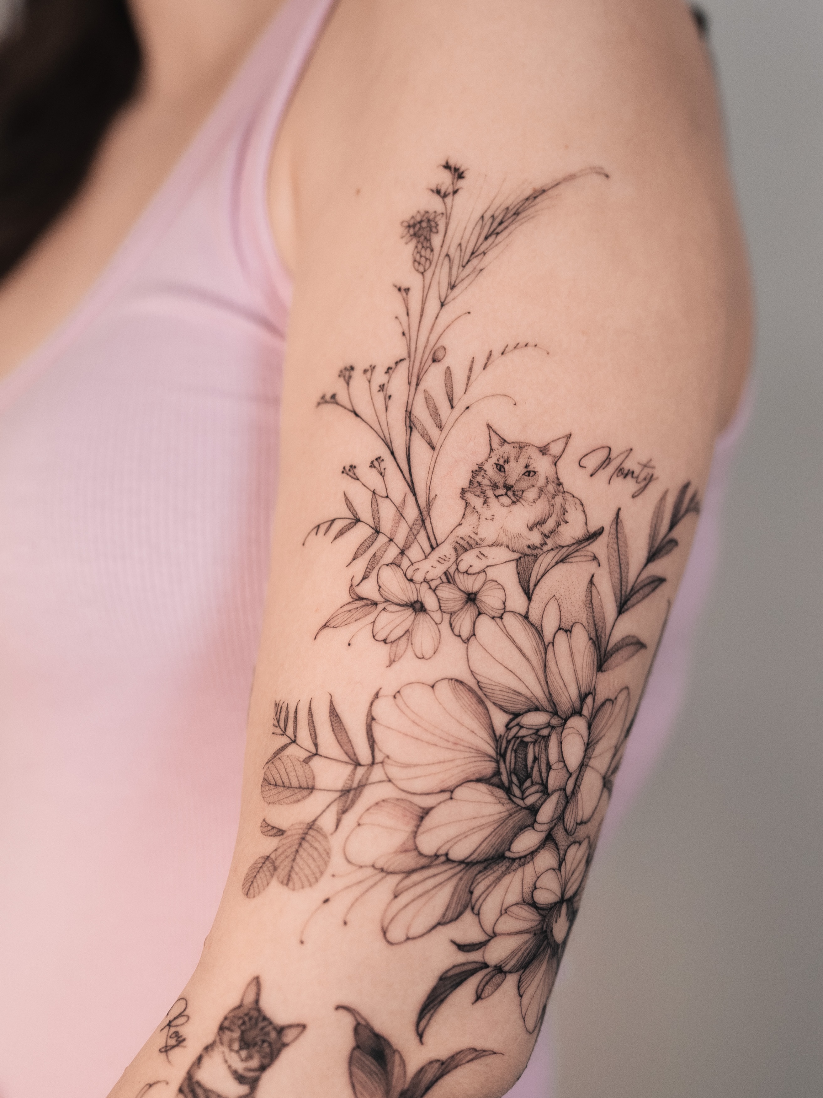 Cat and floral bouquet realism tattoo on the forearm by Yuliia Babych tattoo AUSTIN
