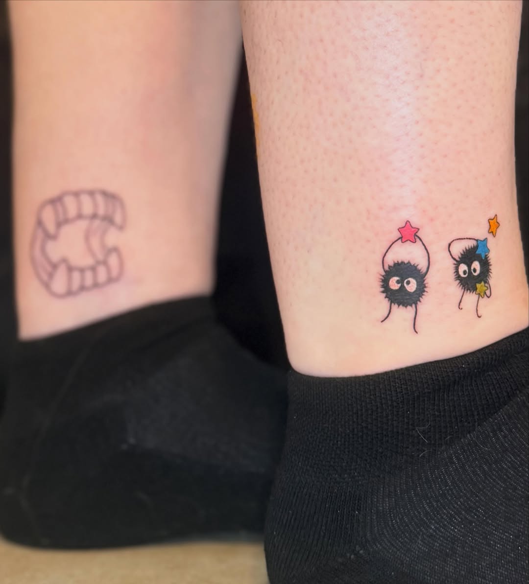 Two cute characters dotwork tattoo on the forearm by Olivia, Royal Oak, Michigan