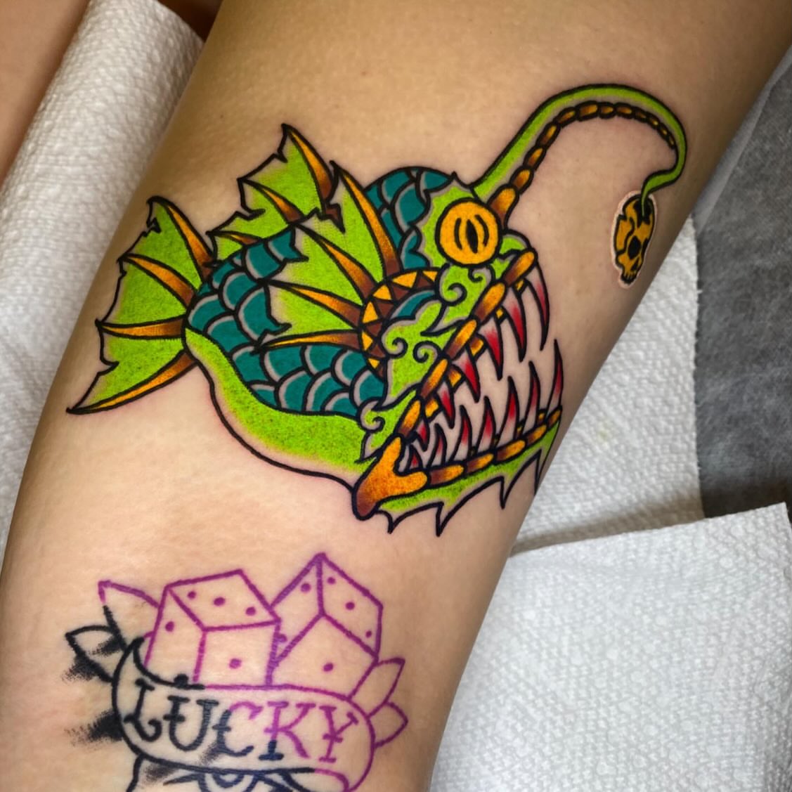 Angler fish American traditional tattoo on the forearm by Nosferatu