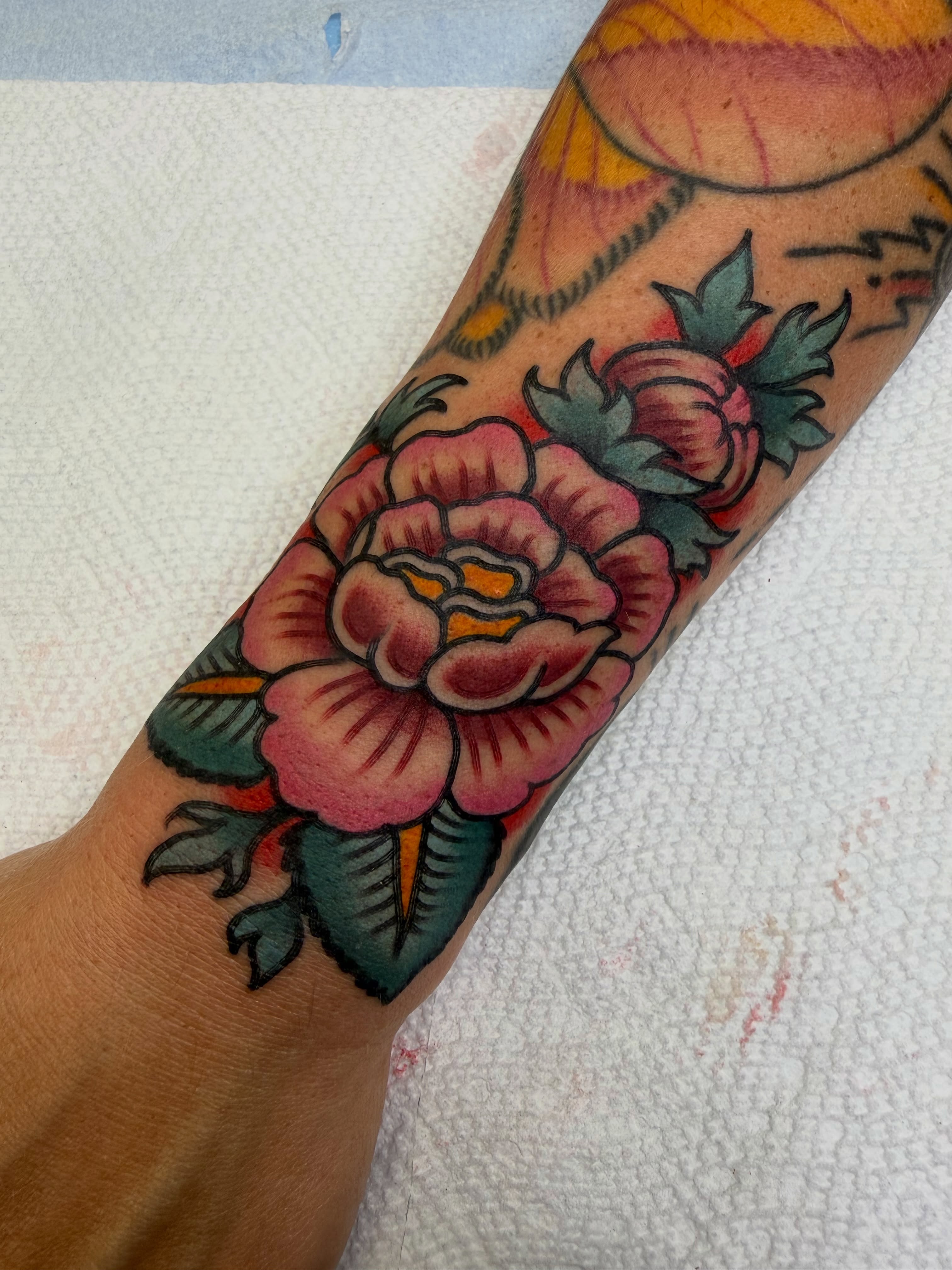 Peony American traditional tattoo on the forearm by morganhabe