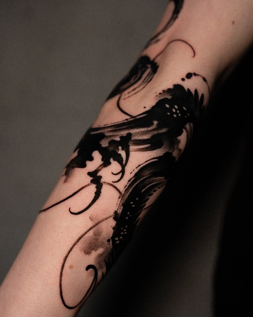 Abstract ink wash sketch tattoo on the forearm by Low, Brooklyn, New York