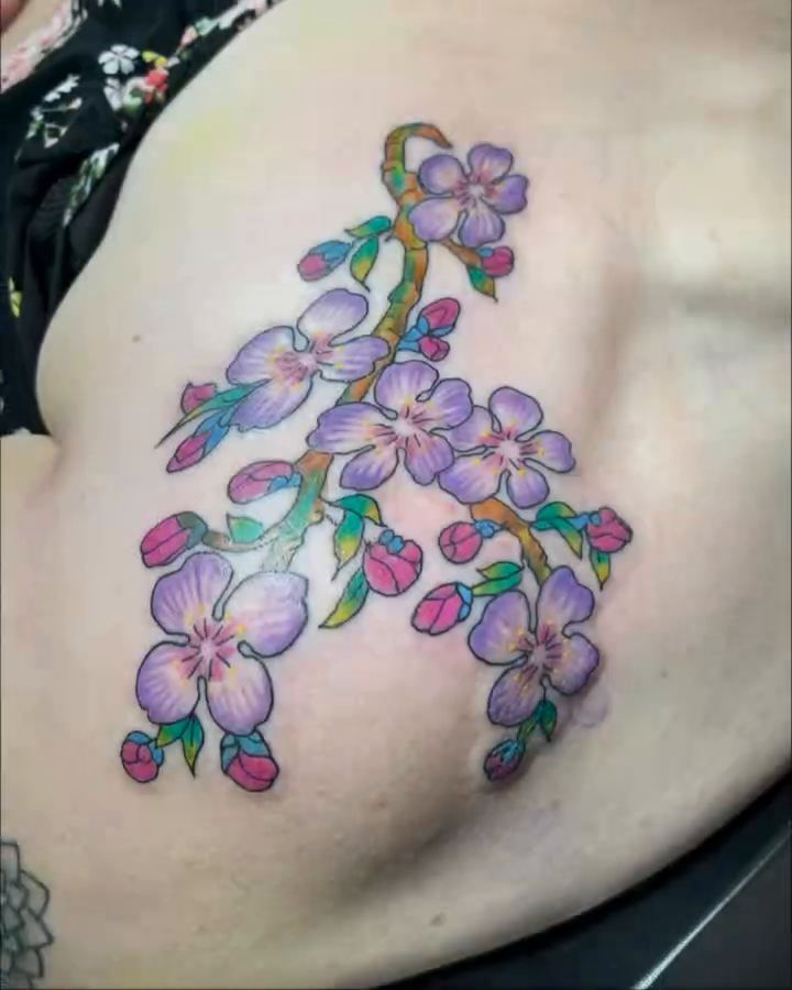 Cherry blossom branch watercolor tattoo on the shoulder by Tattoos by Dan Hatcher Carr, Parma, Ohio