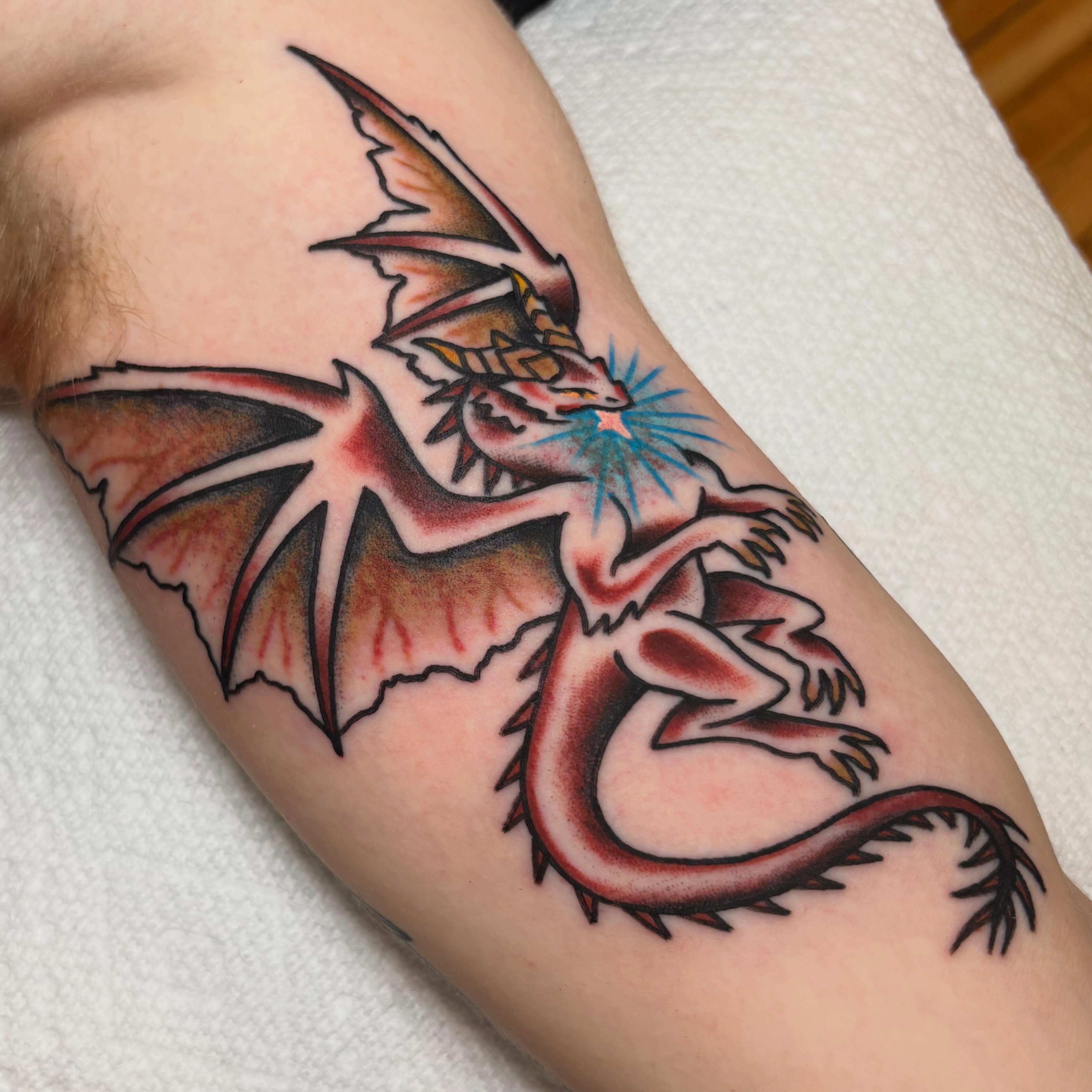 Dragon American traditional tattoo on the forearm by ππππππππ
