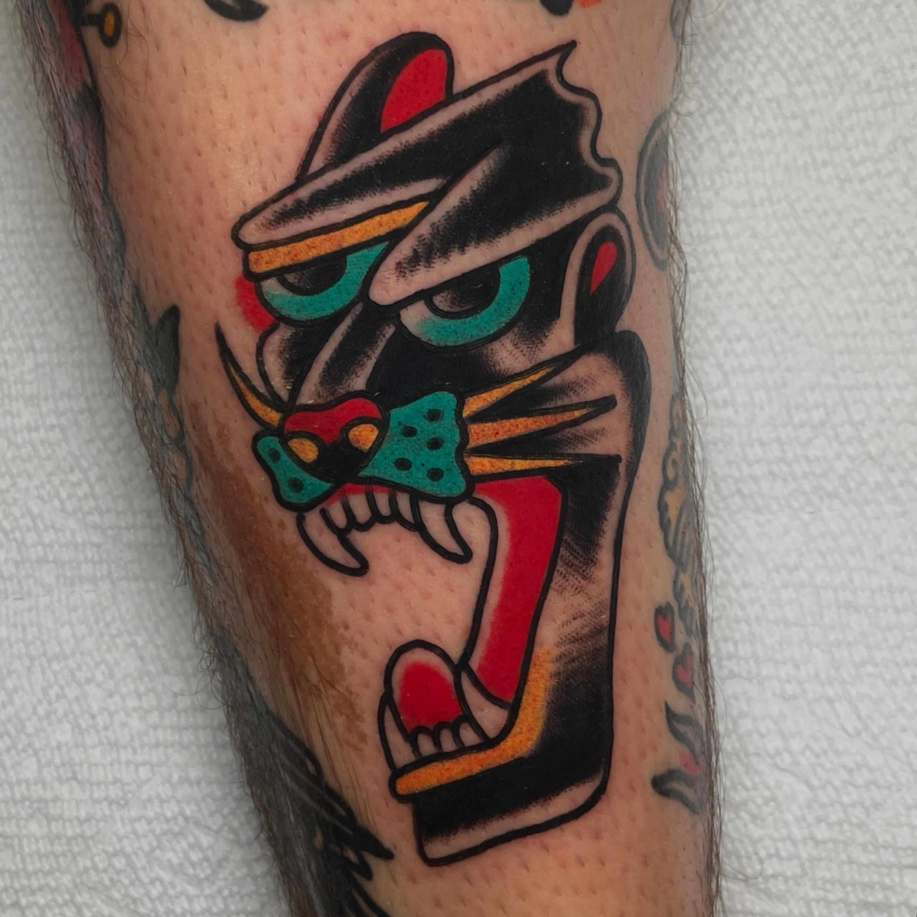 Panther American traditional tattoo on the forearm by Rizzo