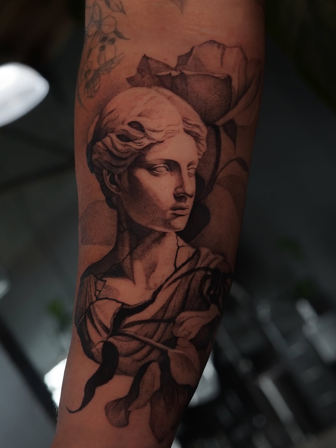 Surrealism tattoo on the forearm by Keely Thompson
