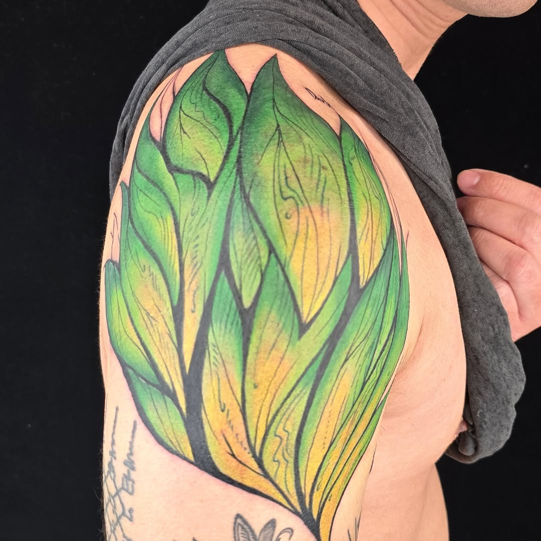 Leaf watercolor tattoo on the shoulder by Tucker