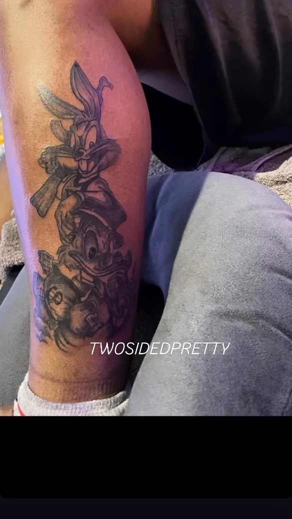Bugs Bunny and Daffy Duck new school tattoo on the leg by @twosidedpretty