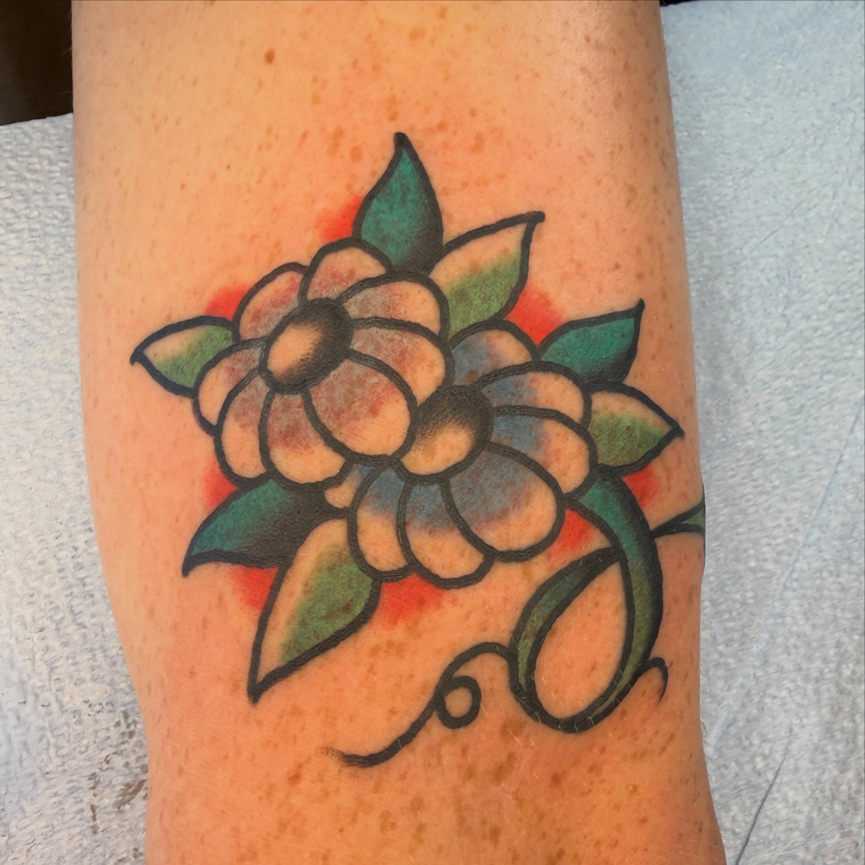 Flower American traditional tattoo on the forearm by Tyler