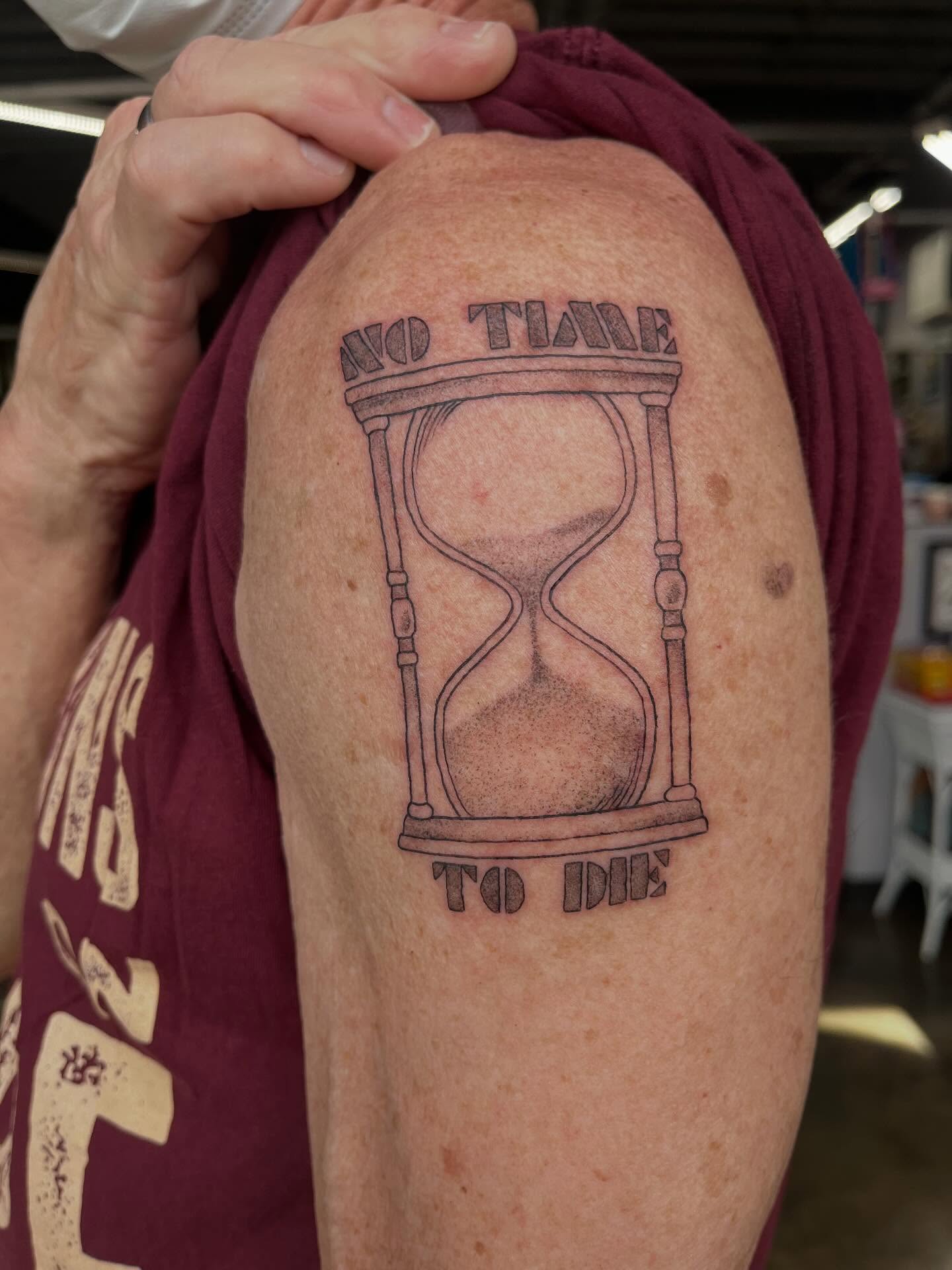 Hourglass black and grey tattoo on the shoulder by bunny, Minneapolis, Minnesota
