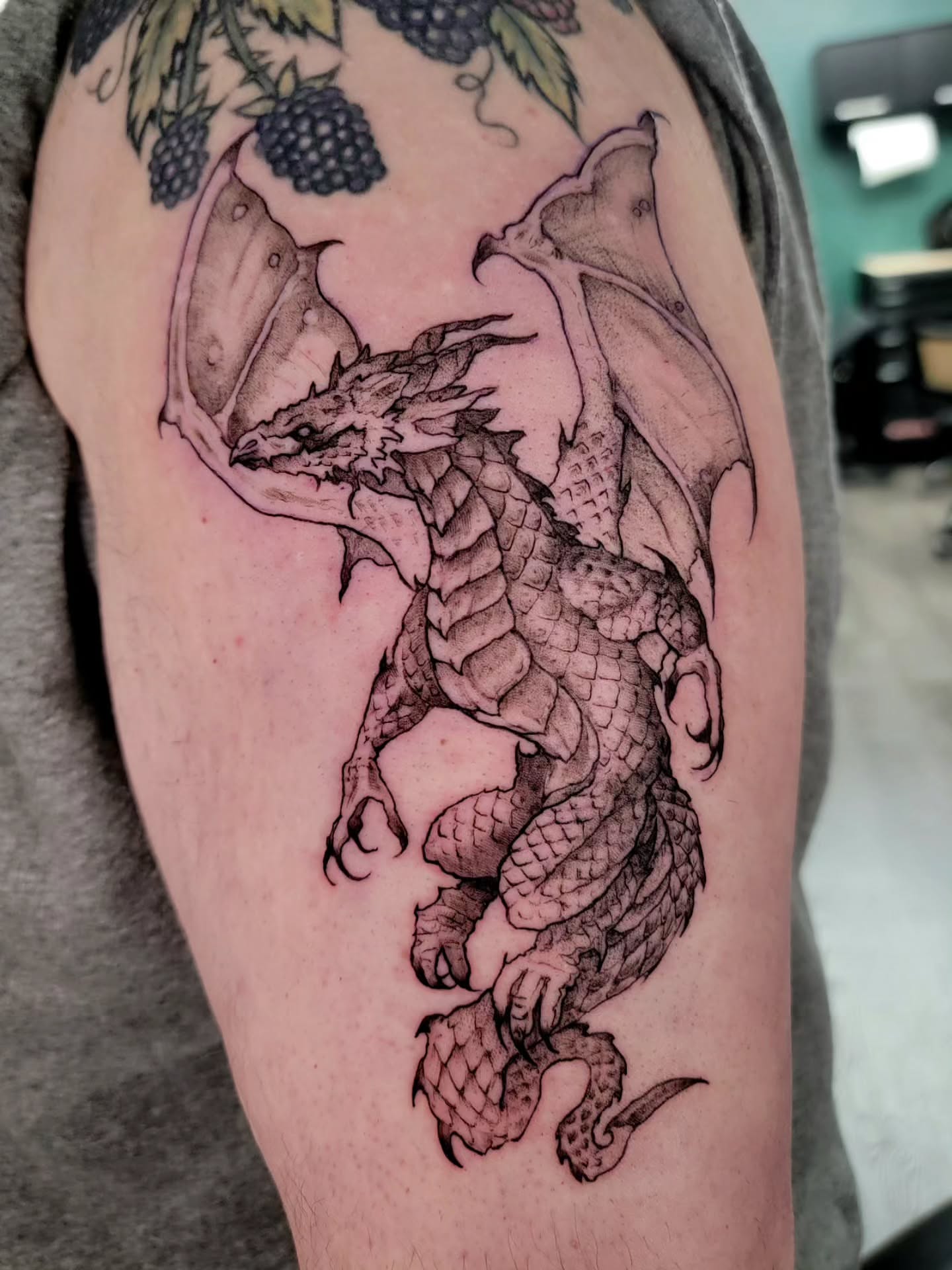 Dragon black and grey tattoo on the forearm by Nathan Harkins-Oberbeck