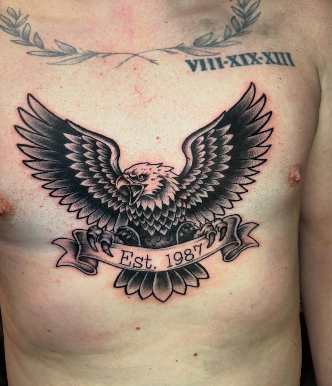 Eagle American traditional tattoo on the chest by Rachel Sellers