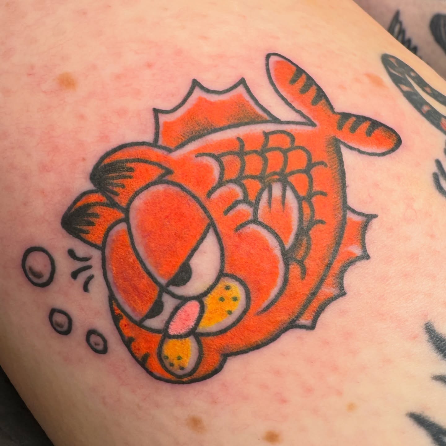 Koi fish American traditional tattoo on the thigh by Joel Smith, Manhattan, Kansas