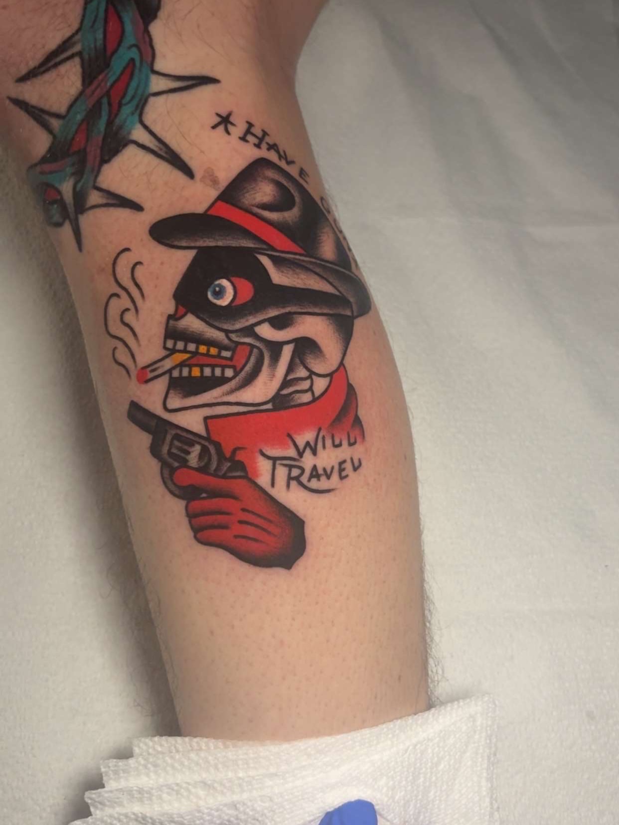 Skull with hat and gun American traditional tattoo on the forearm by Chris Prince Jr., Miamisburg, Ohio