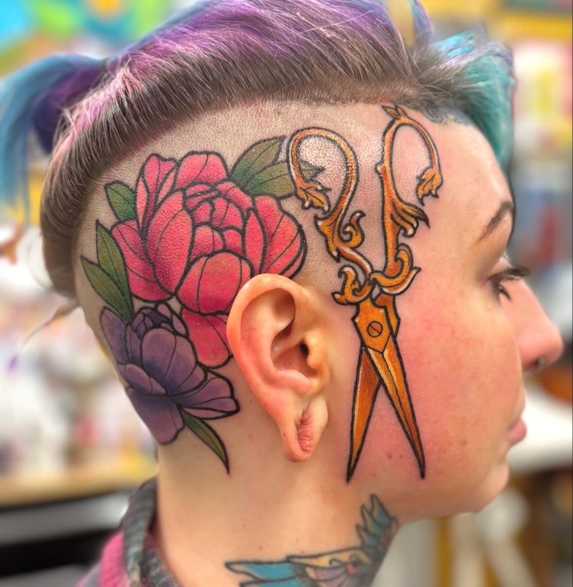 Scissors and flowers American traditional tattoo on the head by Megan
