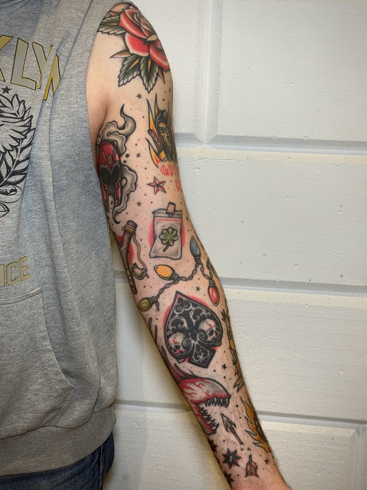 Playing card and skull American traditional tattoo on the forearm by Black and color tattoo!