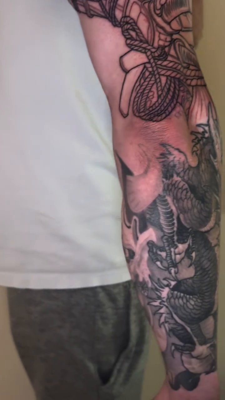 Samurai warrior and dragon sleeve Japanese tattoo on the upper arm by Mike Nance
