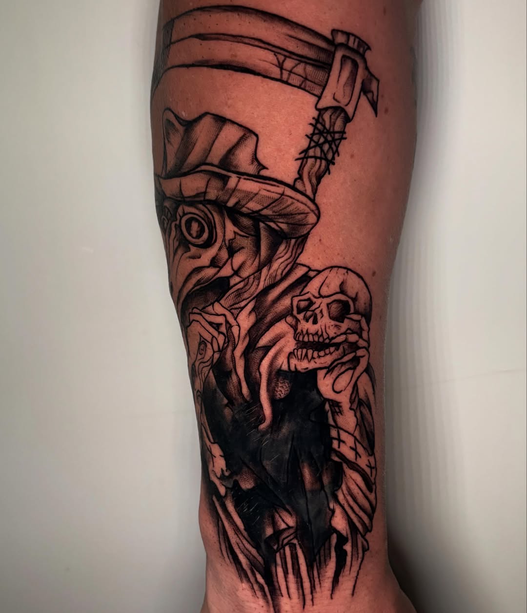 Skull and monster realism tattoo on the forearm by 𝕶𝕬𝕿
